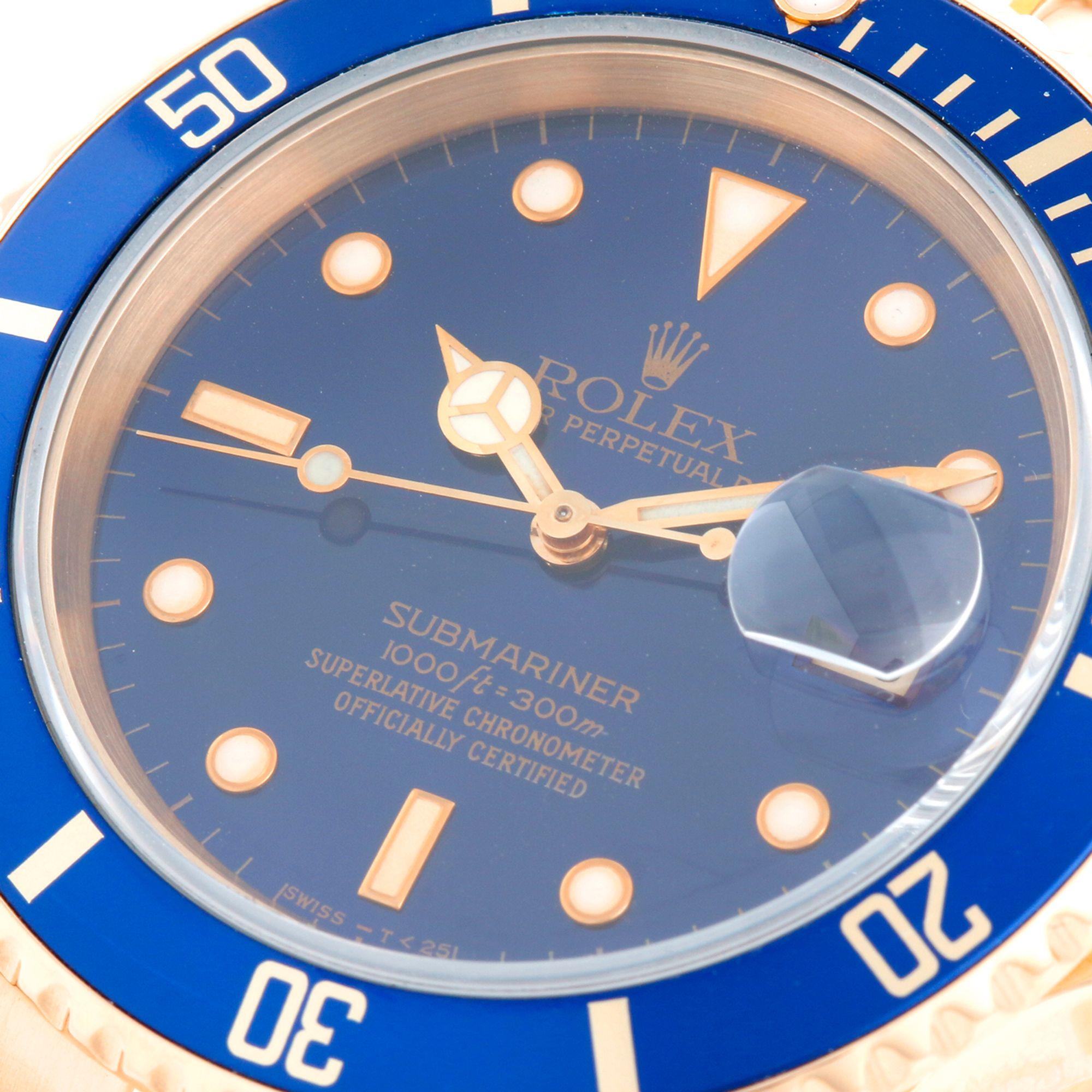 Rolex Submariner Men's 18k Gold Diver's Watch 16618 - Automatic winding, Quickset, sapphire crystal. 18k yellow gold case with rotating bezel with blue insert (40mm diameter). Blue dial. 18k yellow gold Oyster bracelet with flip-lock clasp.