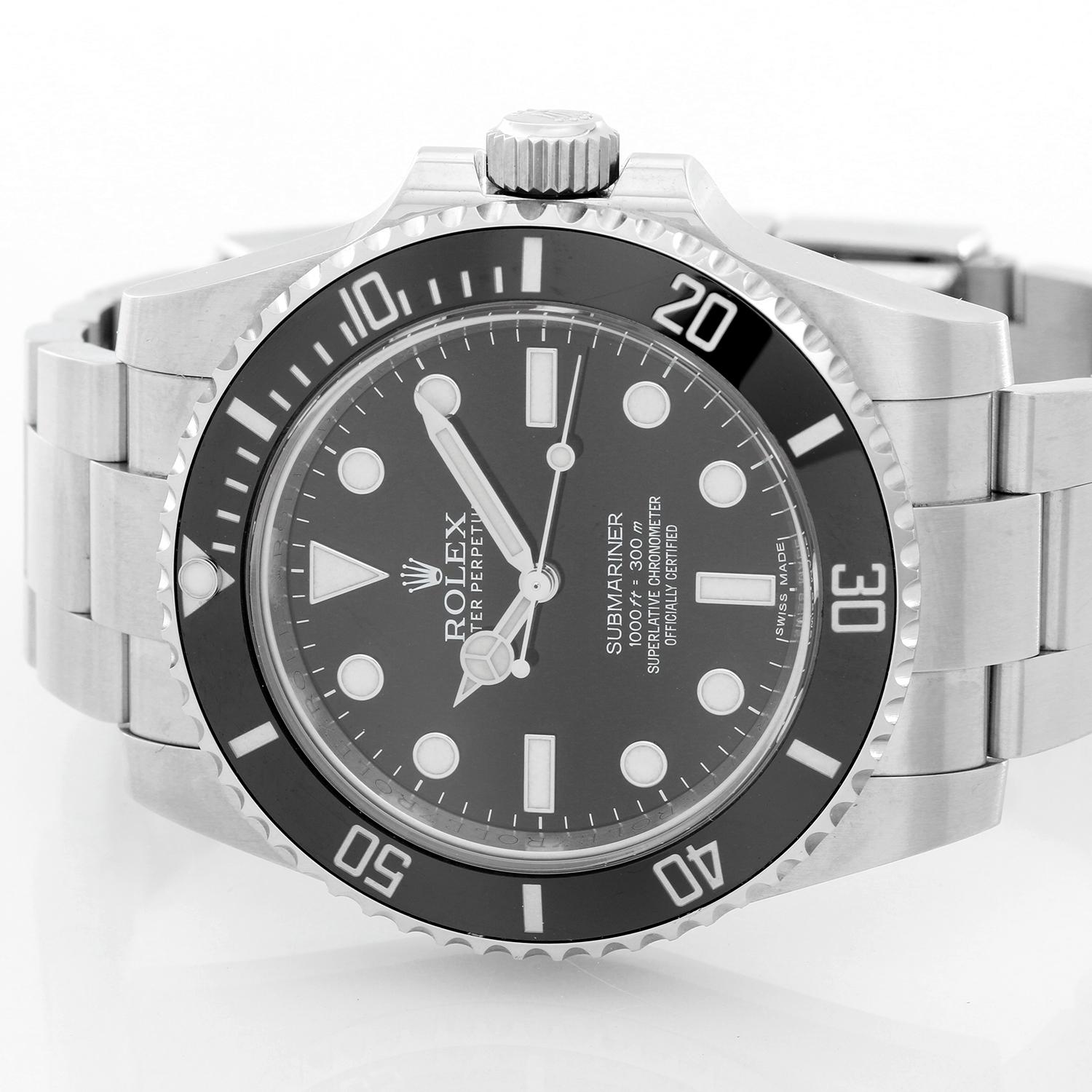 Rolex Submariner Men's Stainless Steel Watch 114060 - Automatic winding, 31 jewels. Stainless steel case with black ceramic bezel insert (40mm diameter). Black dial with luminous style markers. Stainless steel Oyster bracelet with flip-lock clasp.