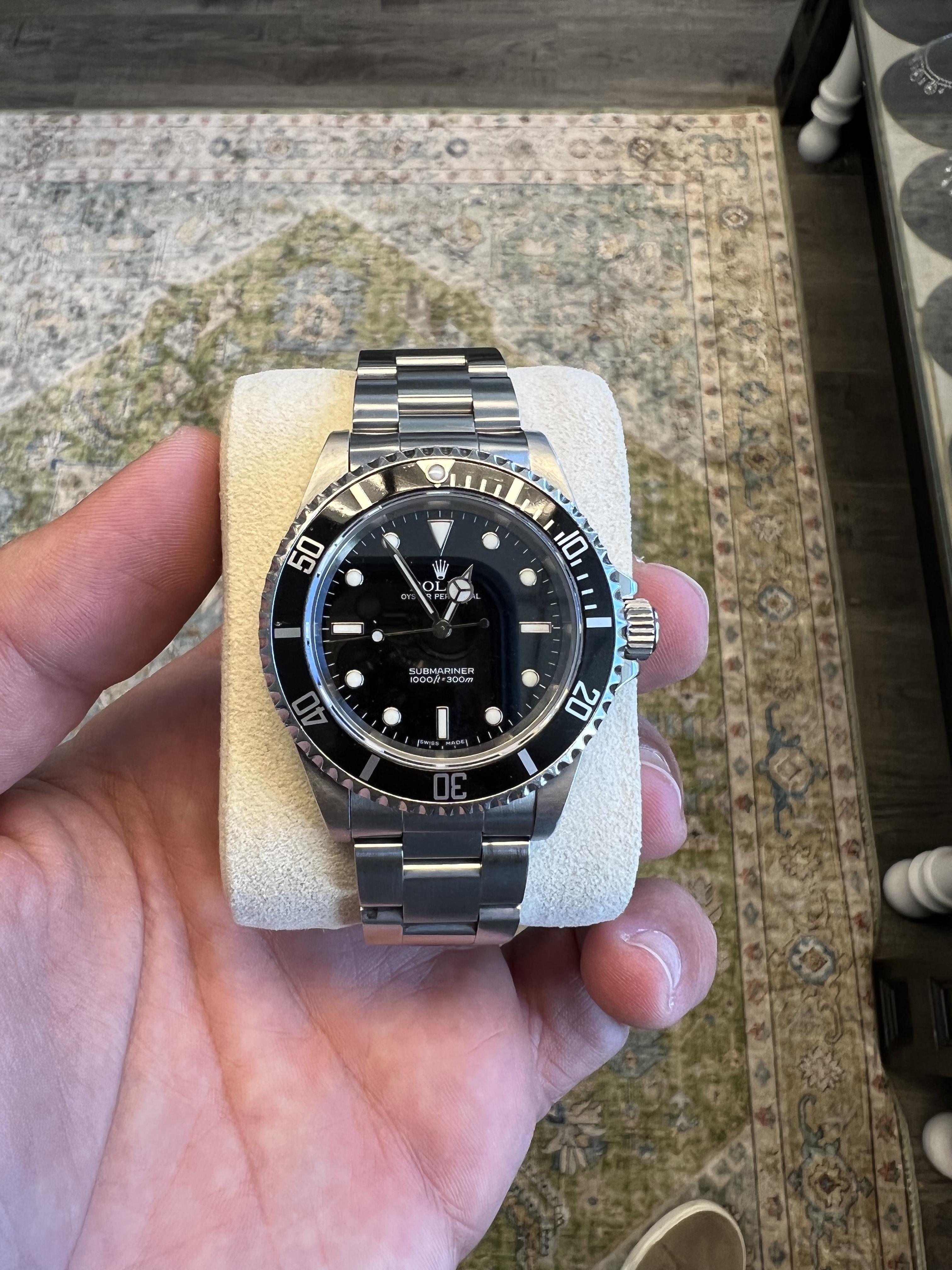 BRAND: Rolex
MODEL: Submariner No Date
REFRENCE: 14060M
SIZE: 40mm
CASE: Stainless Steel
DIAL: Black
BEZEL: Black
BAND: Oyster Steel
WRIST SIZE: 8
MOVEMENT: Automatic

Has been re-polished, Bracelet slightly loose
No box or papers

Accommodated with