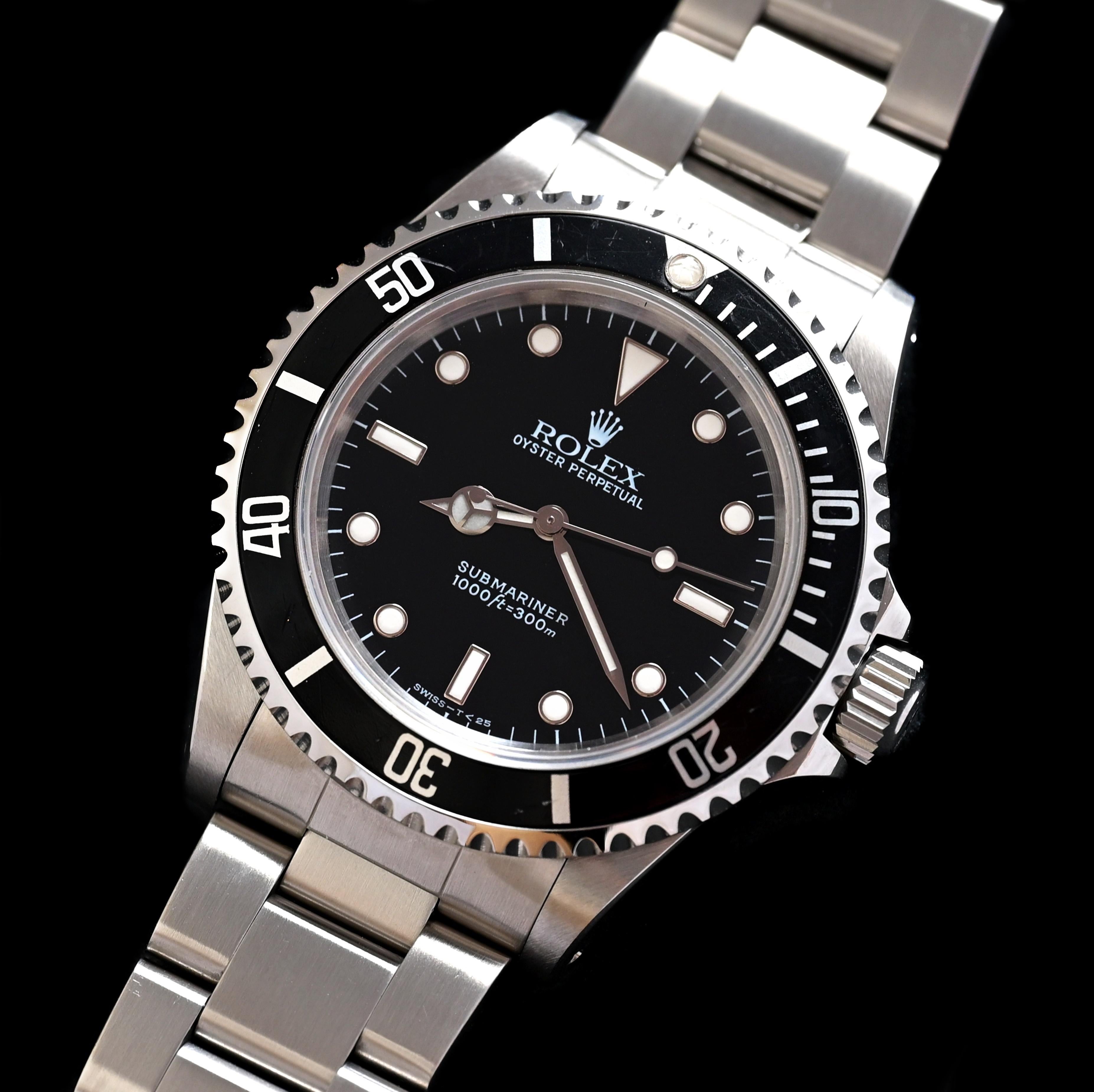Marca: Rolex
Model No: 14060
Año: 1997
Número de serie: U2xxxxx

Referencia: C04062

Caja: Muestra signos de desgaste con un ligero pulido de la anterior con el fondo interior de la caja estampado 14060

Esfera: Esfera negra de tritio en excelente