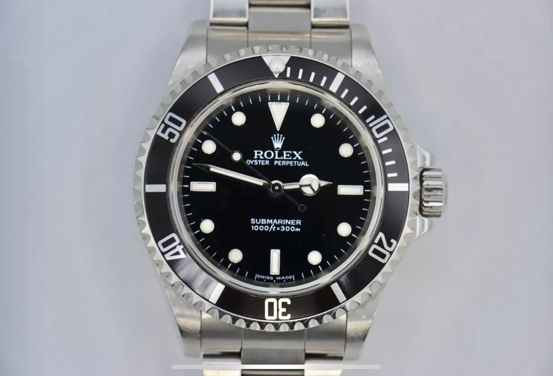 Description / Condition: All watches have been professionally scrutinized and serviced prior to being offered for sale. This model is referred to as the Rolex Submariner Ref. # 14060M, Circa 2006 with 
Rolex Box and Booklets.

Manufacturer: