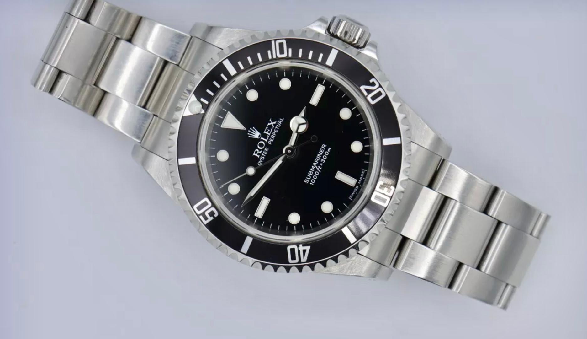 Modern Rolex Submariner Non-Date 4 Liner 14060M Circa 2006 with Rolex Box and Booklets