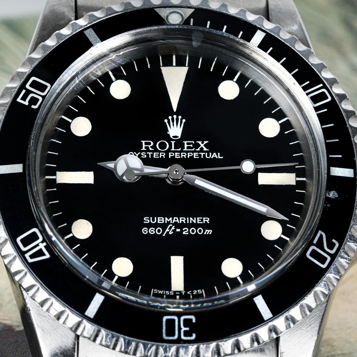 A 40mm stainless steel Submariner Non-Date by Rolex. Featuring a distinctive black Mark III maxi dial. The features of this particular dial include:

• Large tritium hour plots that often appear to touch the 5-minute hash marks, giving it the