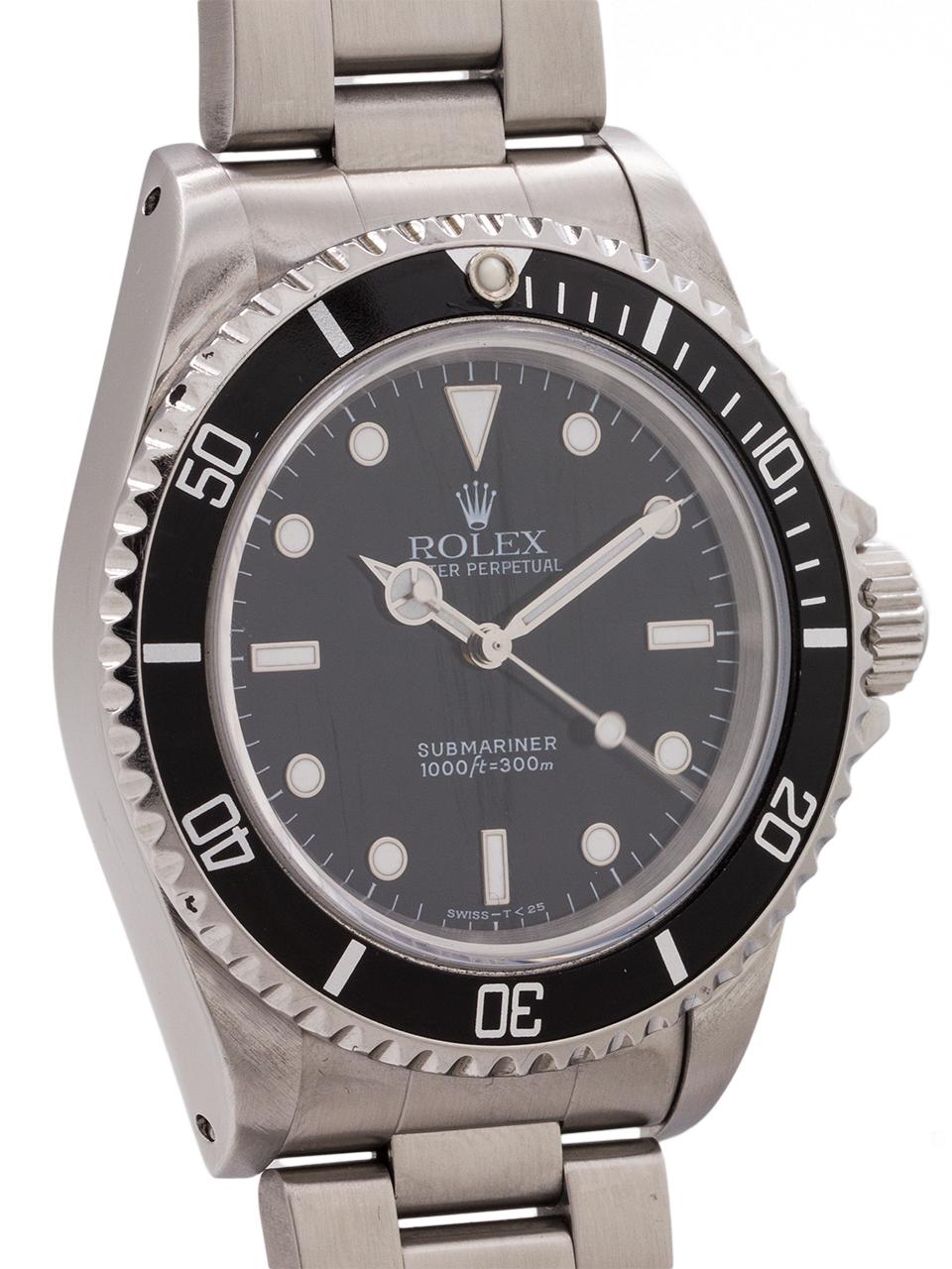 
Classic Rolex Submariner stainless steel ref# 14060 T6 serial # circa 1996. Featuring a 40mm diameter case with sapphire crystal and unidirectional elapsed time bezel. Very clean example with glossy black original dial with tritium luminous indexes