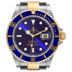 Rolex Submariner Herrenuhr aus Stahl Gelbgold mit lila-blauem Zifferblatt 16613