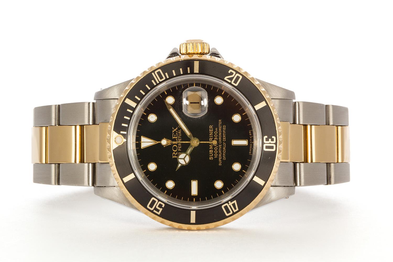 We are pleased to offer this 1991 Rolex Mens Two Tone Submariner 16613. It features a 40mm stainless steel case with black dial, 18k yellow gold bezel with black metal insert and 18k yellow gold polished center links. It will fit up to a 8