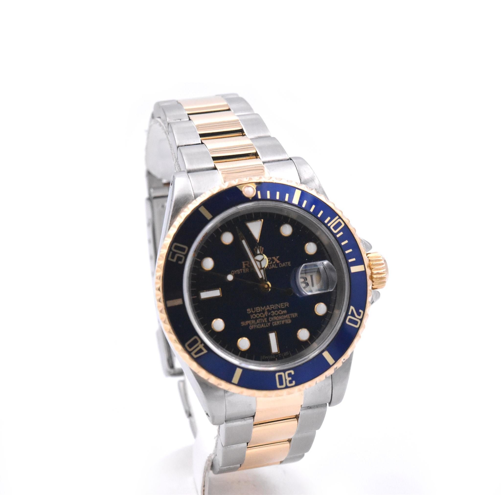 Movement: automatic 
Function: hours, minutes, seconds, date
Case: 40mm 18k yellow gold and stainless-steel case, sapphire crystal, 18k yellow gold bezel with blue insert, yellow gold screw-down crown, waterproof to 100 meters
Band: two-tone 18k