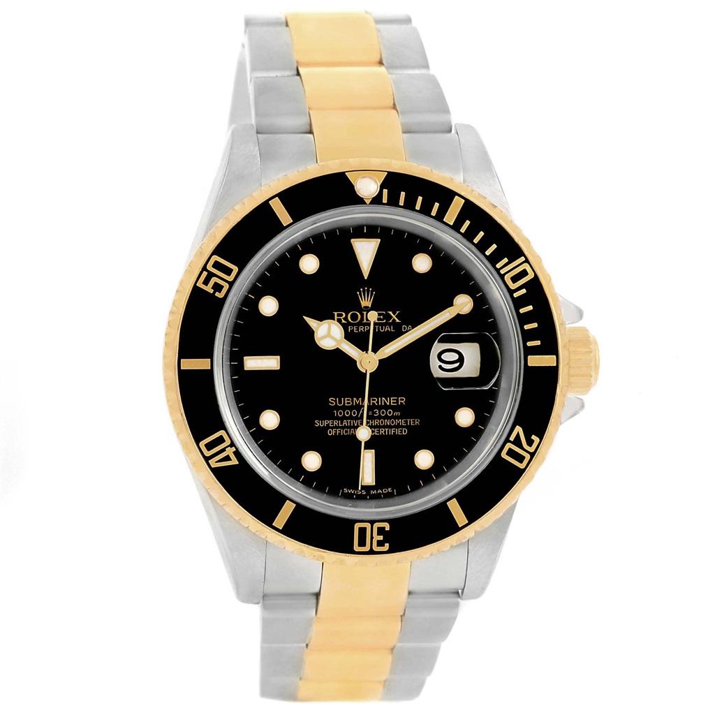 Rolex Submariner Two Tone Steel Yellow Gold Black Dial Watch 16613. Officially certified chronometer automatic self-winding movement. Stainless steel and 18k yellow gold case 40 mm in diameter. Rolex logo on a crown. Black insert special time-lapse