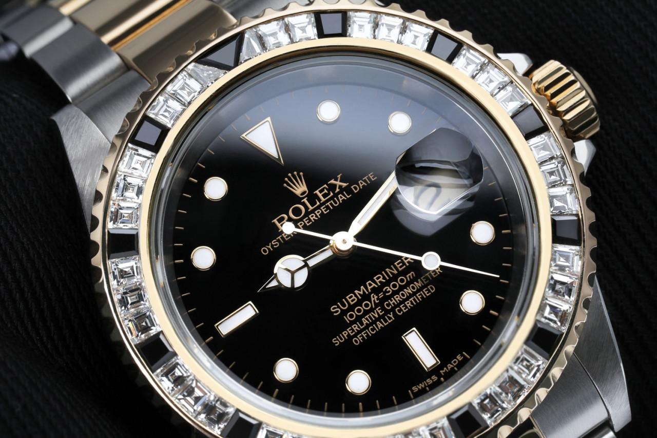 Rolex Submariner Two Tone Watch With Custom Diamond Bezel 16613. This watch is in like new condition. It's been polished, serviced and has no visible blemishes.
