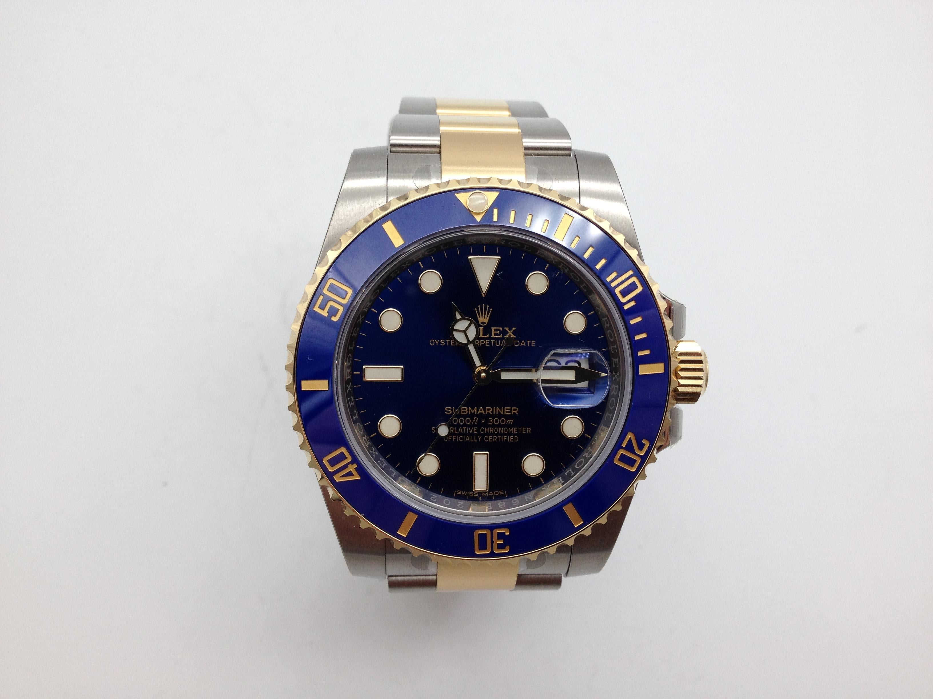 New, never worn, in plastic Rolex Submariner men's wrist watch stainless steel and gold, 40 mm., reference 116613. With Box And Papers. 5 years international warranty.