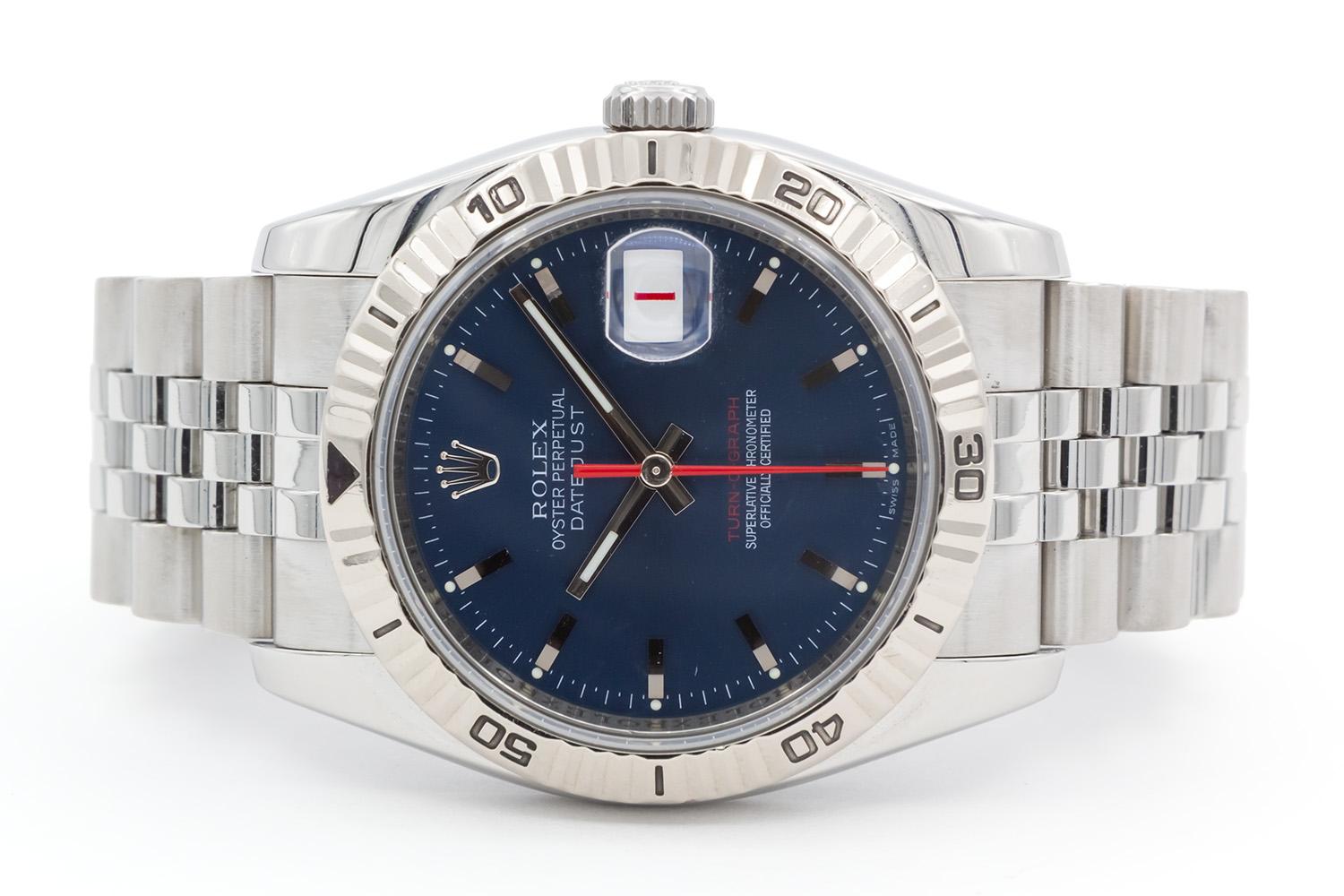 We are pleased to offer this 2006 Rolex Thunderbird Turn-O-Graph Datejust 116264. This is a great Rolex for a man or a woman especially with women wearing larger watches these days. It features a stunning Rolex factory blue sunburst dial with stick