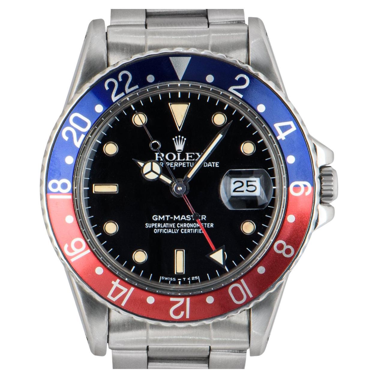 A Stainless Steel Transitional GMT-Master Vintage Men's Wristwatch, black dial with applied hour markers, date at 3 0'clock, a stainless steel bi-directional rotating bezel with a blue and red 