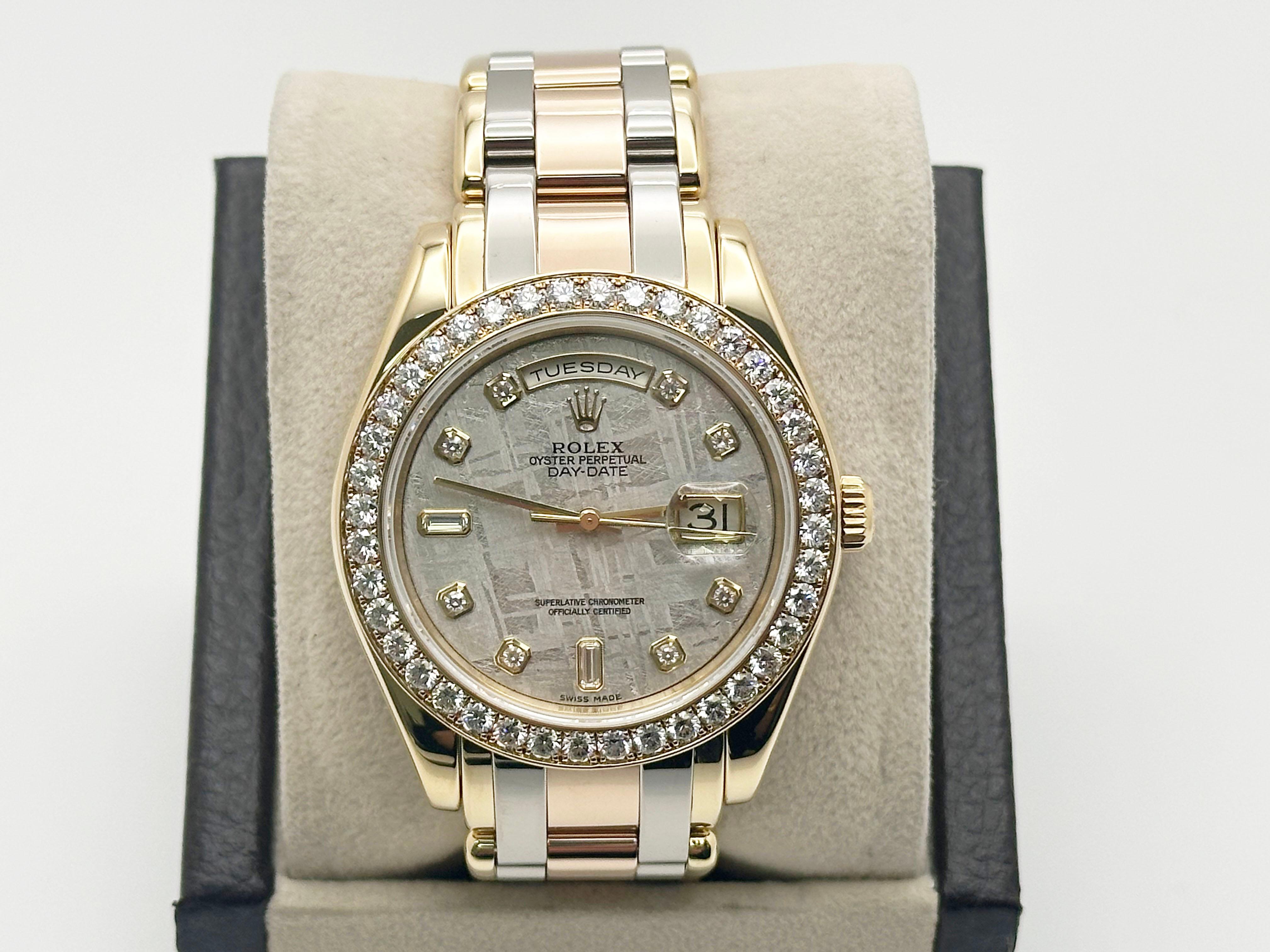 Style Number: 18948



Serial: K556***



Year: 2003

 

Model: Rolex Tridor Masterpiece 

 

Case Material: 18K Yellow Gold 

 

Band: 18K Yellow, Rose, & White Gold 

  

Bezel: Original Factory Diamond Bezel 

  

Dial: Original Factory Meteorite