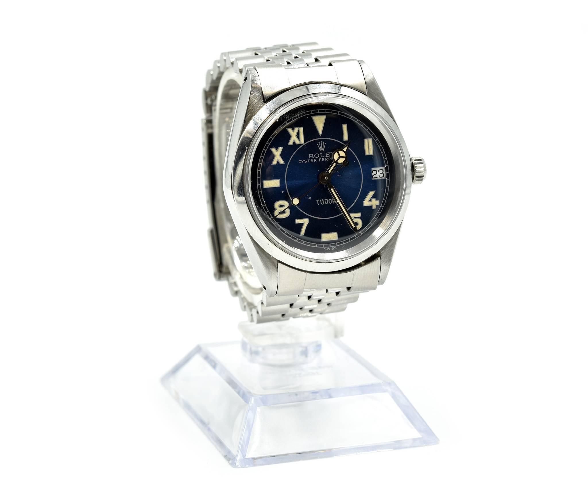 Movement: automatic
Function: hours, minutes, seconds, date
Case: round 34mm stainless steel case, stainless steel smooth bezel, plastic crystal, screw-down crown, waterproof to 100 meters 
Band: stainless steel jubilee bracelet
Dial: blue