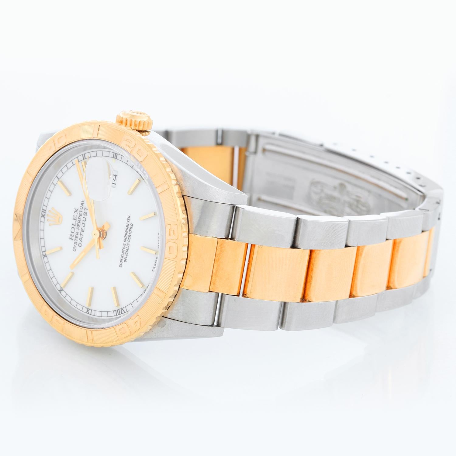 Rolex Turnograph Men's 2-Tone Watch 16263 - Automatic winding, Quickset, sapphire crystal. Stainless steel case with 18k yellow gold bezel. White dial with stick hour markers. Stainless steel and 18k yellow gold Oyster bracelet. Pre-owned with Rolex