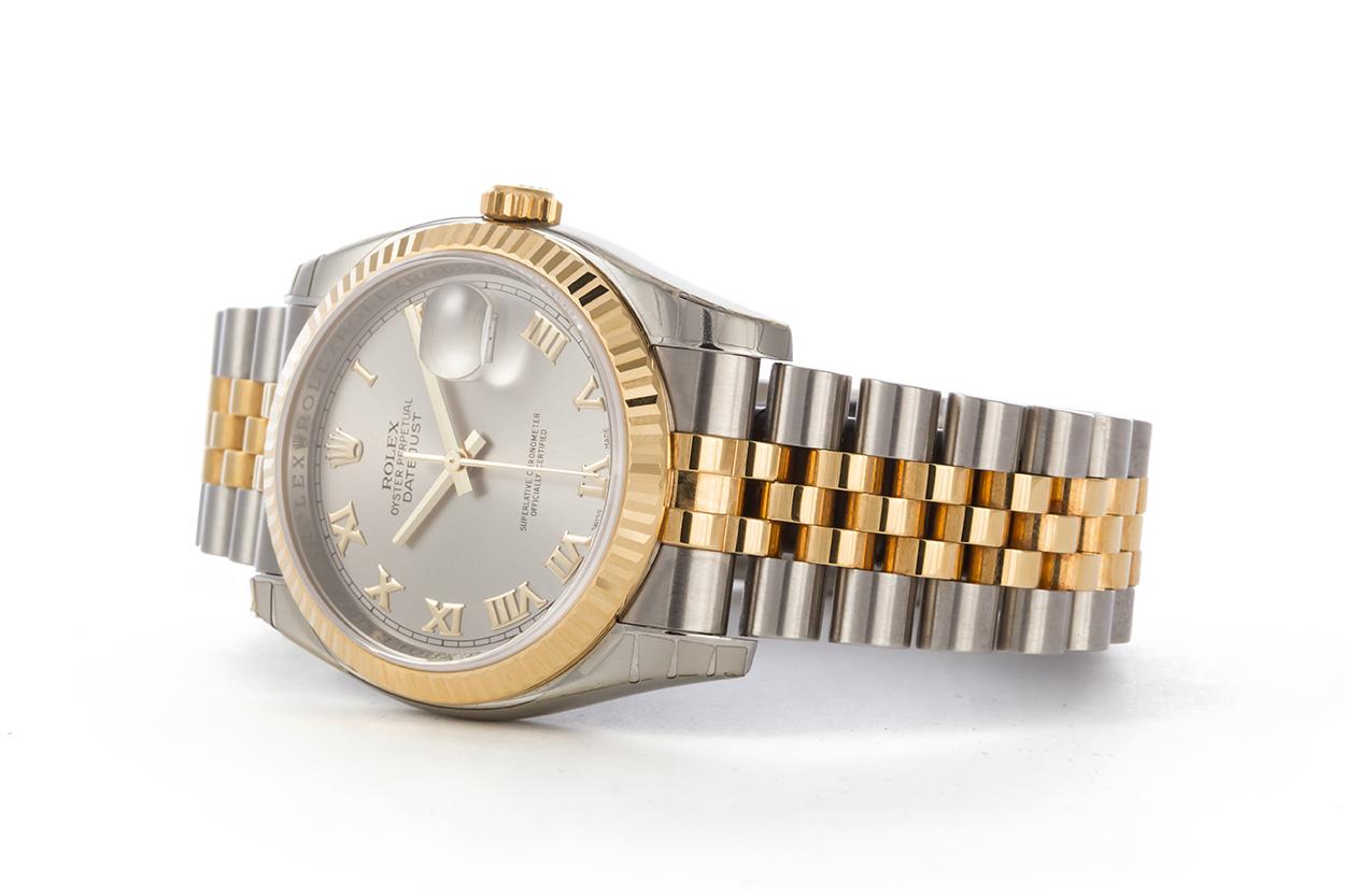 We are pleased to offer this 2006 Rolex Two Tone 18k Gold & Stainless Steel 36mm Datejust 116233. This is a great Rolex for a man or a woman especially with women wearing larger watches these days. It features an Rolex factory slate roman dial,