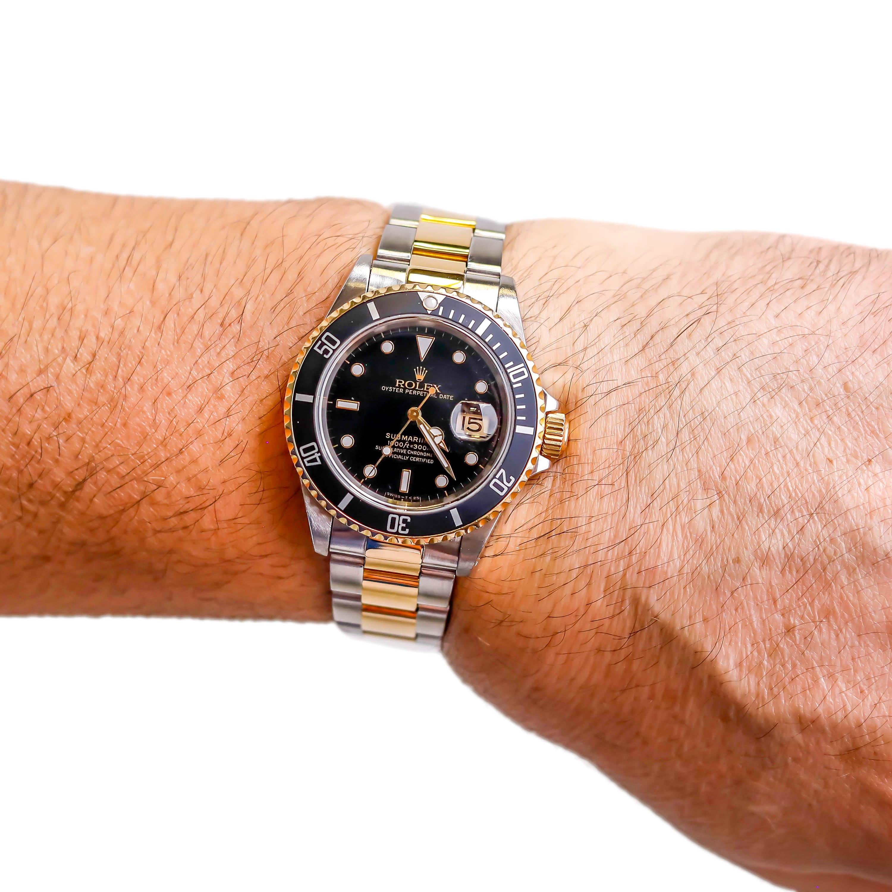 gold submariner on wrist