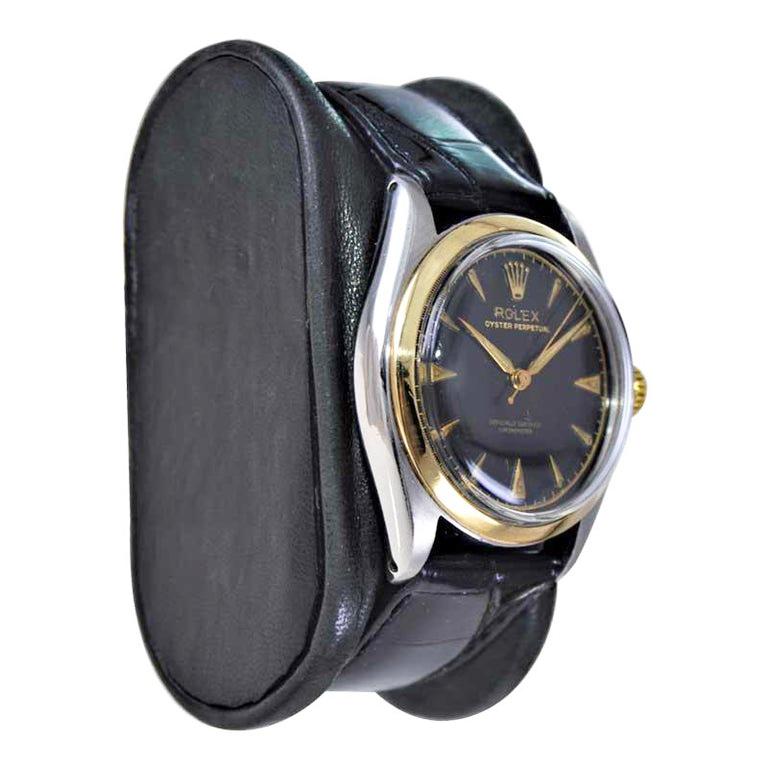 FACTORY / HOUSE: Rolex Watch Company
STYLE / REFERENCE: Oyster Perpetual / Reference 6084
METAL / MATERIAL: Stainless Steel & 14Kt. Yellow Gold
CIRCA / YEAR: 1951
DIMENSIONS / SIZE: Length 33mm X Diameter 40mm
MOVEMENT / CALIBER: Perpetual Winding /