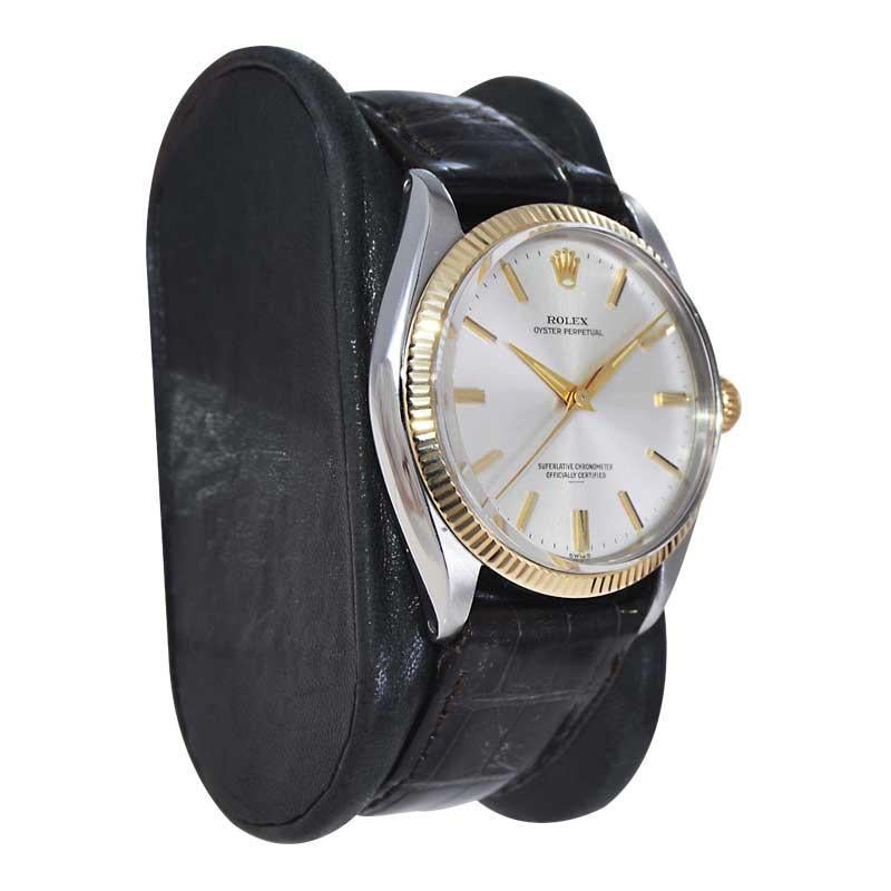 FACTORY / HOUSE: Rolex Watch Company
STYLE / REFERENCE: Oyster Perpetual / Reference 1005
METAL / MATERIAL: Two Tone Steel and Yellow Gold 
CIRCA / YEAR: Mid 1960's
DIMENSIONS / SIZE: Length 39mm X Diameter 34mm
MOVEMENT / CALIBER: Perpetual Winding
