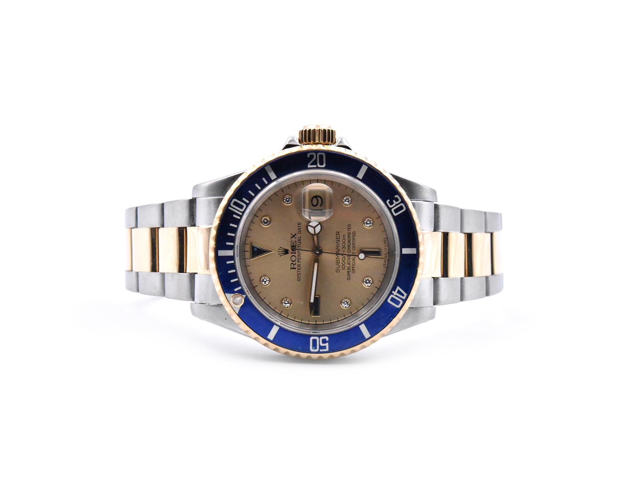 Movement: automatic
Function: hours, minutes, sweep seconds, date at 3 o’clock
Case: 40mm stainless steel case, rotating 18k yellow gold blue bezel, scratch resistant sapphire crystal, 
Dial: champagne serti dial, sapphire and diamond hour markers,