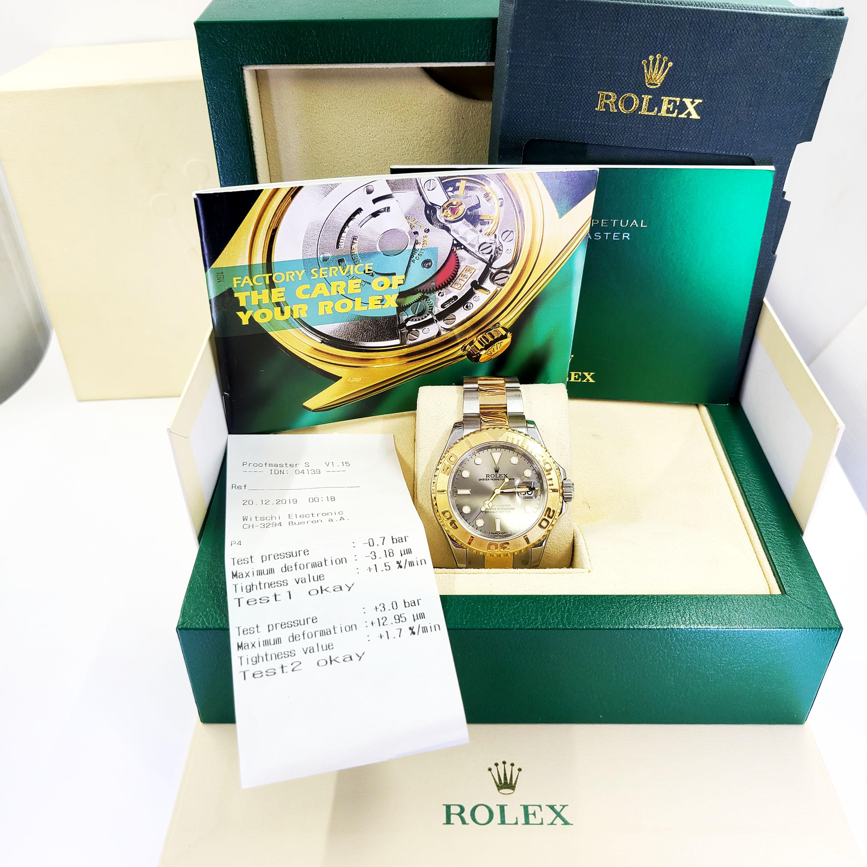 Pre-Owned 18 Karat Yellow Gold & Stainless Steel 40mm Rolex Yachtmaster Automatic Wristwatch On Oyster Bracelet With Silver Dial. Model #16623, V Serial Circa 2009. Includes Original Box, Booklets, and 1 Year Timekeeping Warranty.