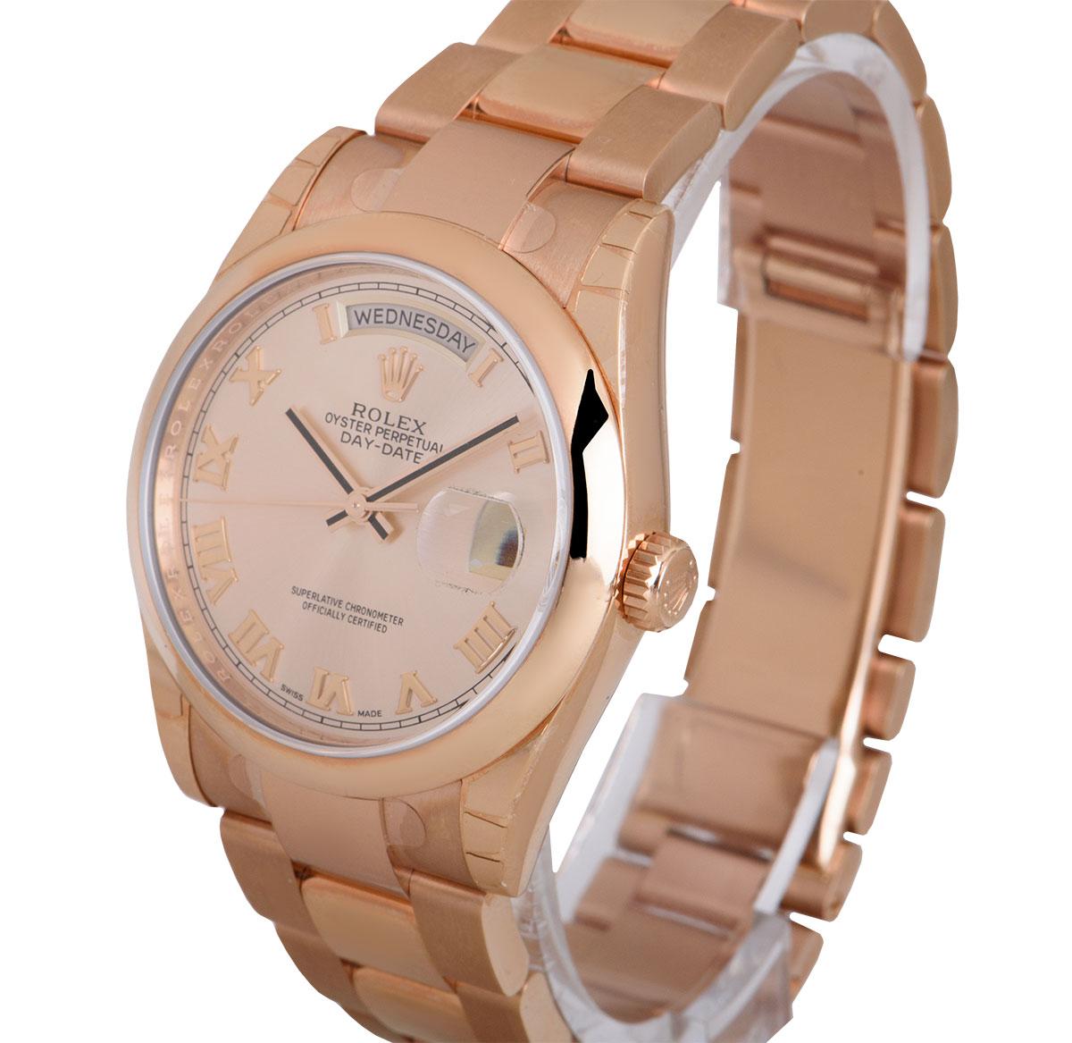 A 36 mm Unworn 18k Rose Gold Oyster Perpetual Day-Date 36 Gents Wristwatch, rose dial with applied roman numerals, day at 12 0'clock, date at 3 0'clock, a fixed 18k rose gold smooth bezel, an 18k rose gold oyster bracelet with a concealed 18k rose