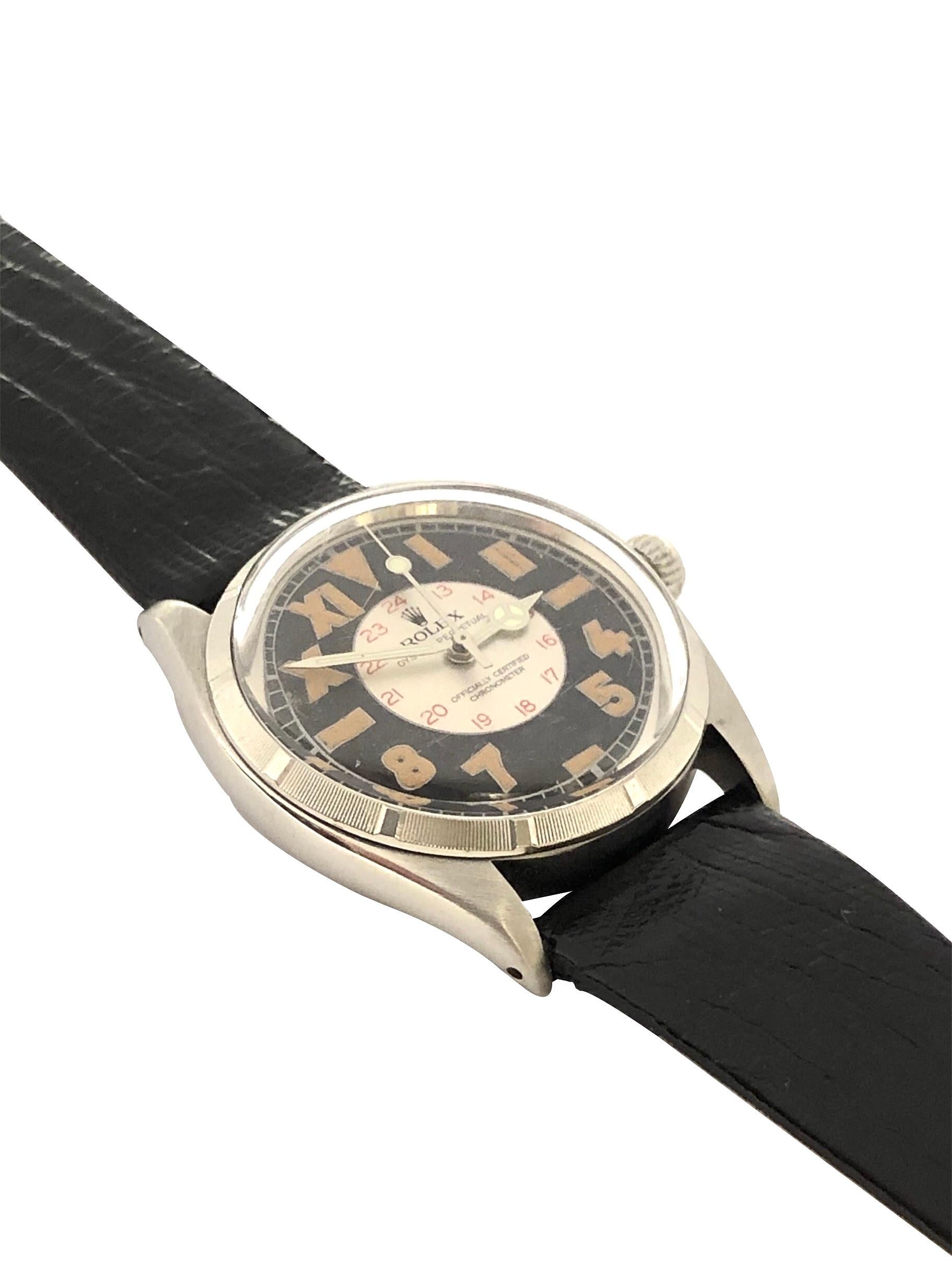Circa 1944 Rolex Reference 6565 Wrist watch, 34 M.M. Stainless Steel 2 Piece Oyster case with Engine Turned Bezel, Caliber 1030 Automatic, self Winding movement, Rolex logo crown. Restored Black and Silver Bubble Back style 