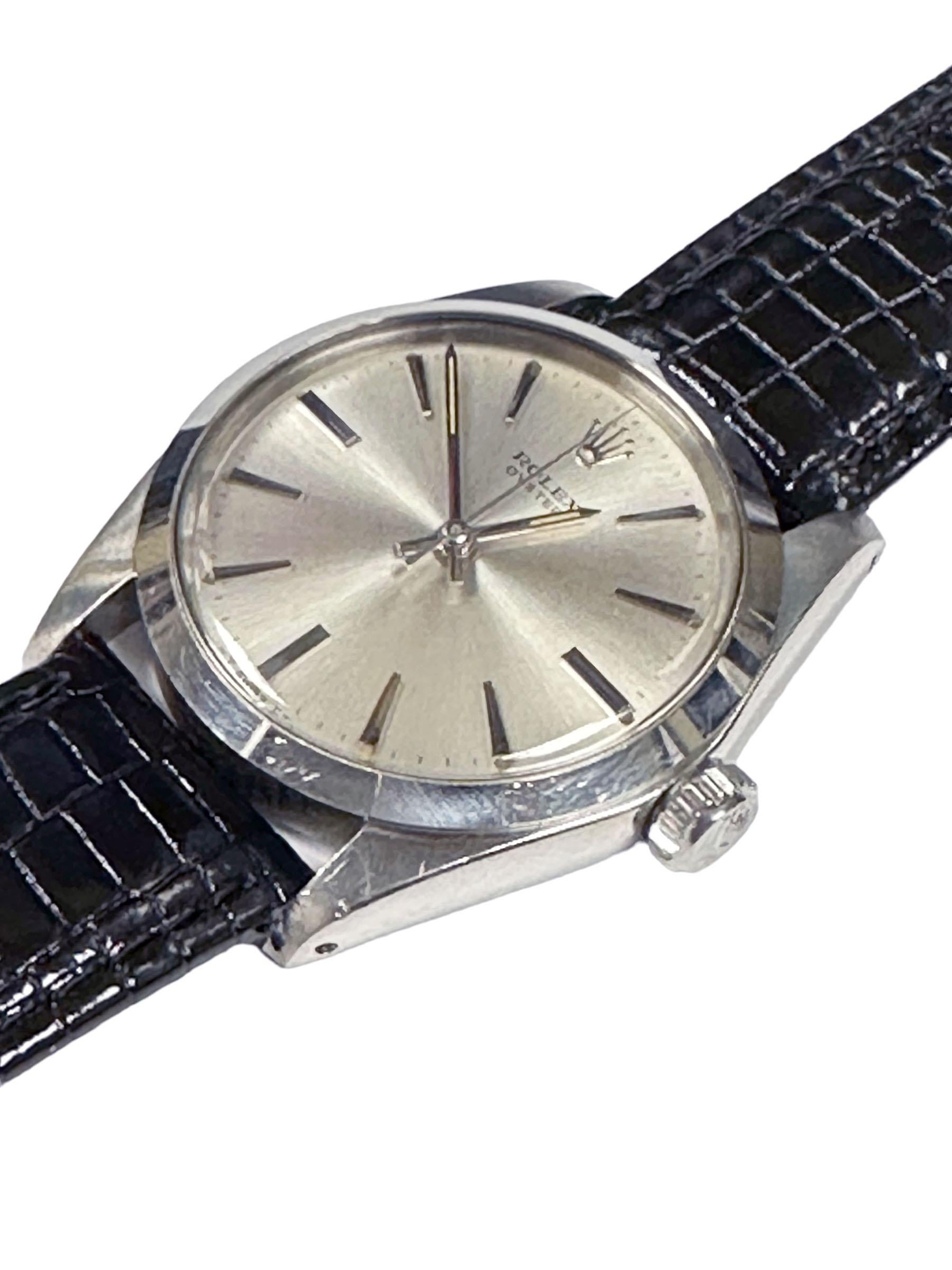 Circa 1959 Rolex Oyster Reference 6426 Wrist Watch, 34 M.M. Stainless Steel 3 Piece Oyster Case, Screw down Rolex Logo Crown, Caliber 1215 Mechanical, Manual wind movement. Beautiful Mint original Silver Satin Sunburst Dial with raised Markers and a