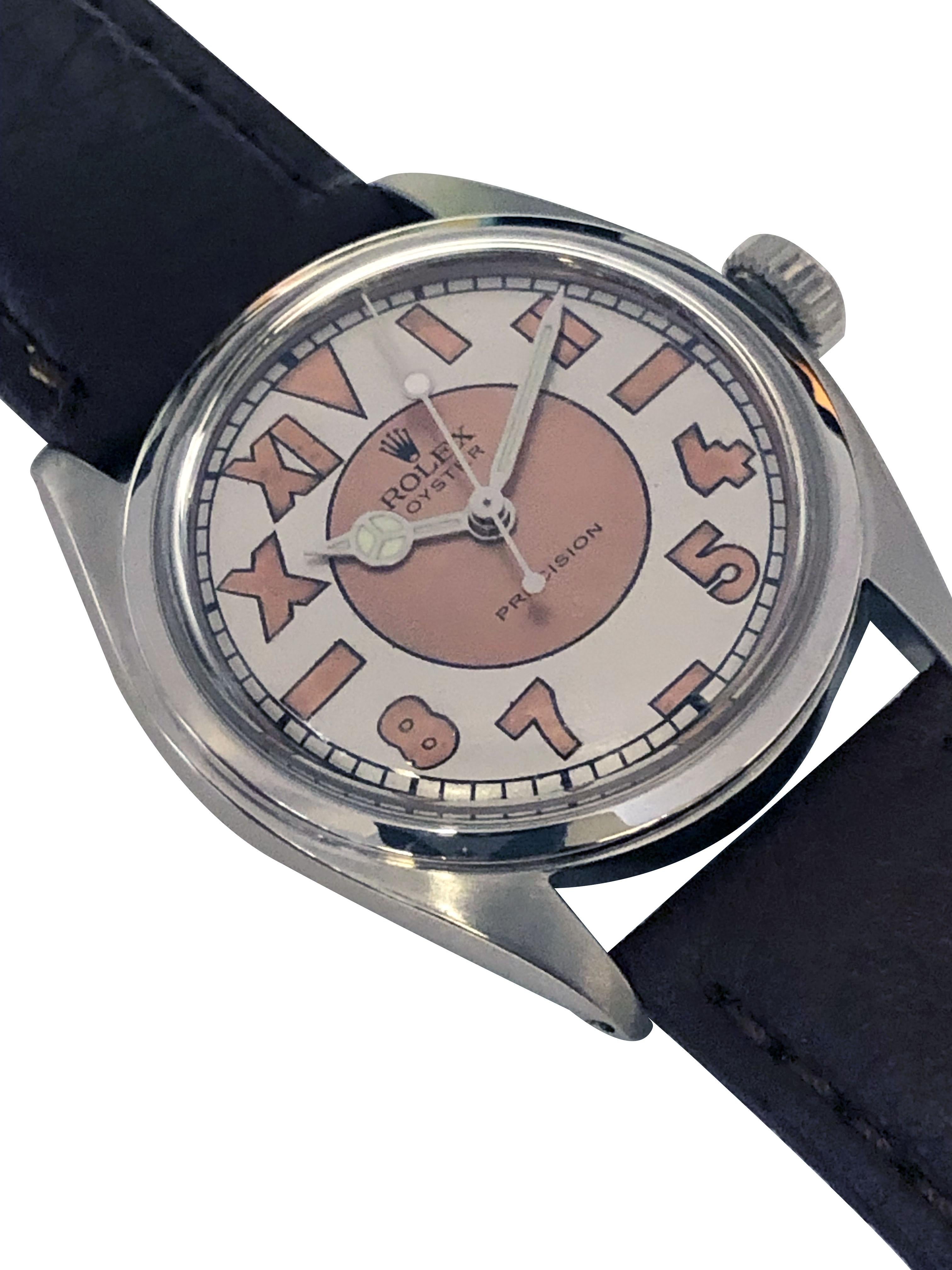 Circa 1950 Rolex Wrist Watch, Reference 5022 34 M.M. Stainless Steel 2 piece case, 17 Jewel, mechanical, manual wind nickle lever movement, Rolex logo Crown, two tone Copper and Silver 