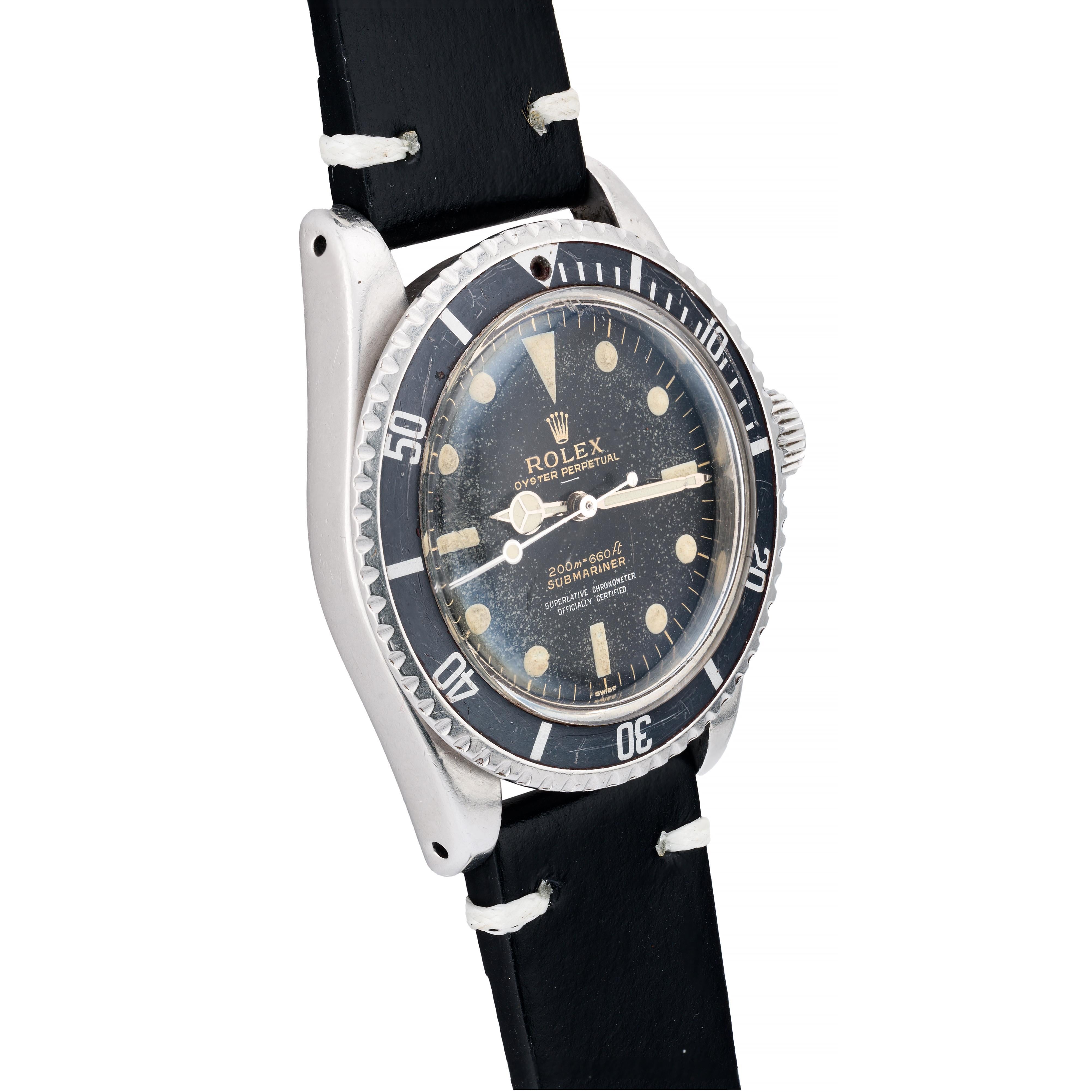Aston Estate Jewelry Presents:

A vintage Rolex Submariner, model 5512, with rare Underline gilt dial and pointed crown guard case.

The round case measures 40mm in width, featuring the original black dial with gilt writing. The dial is marked by