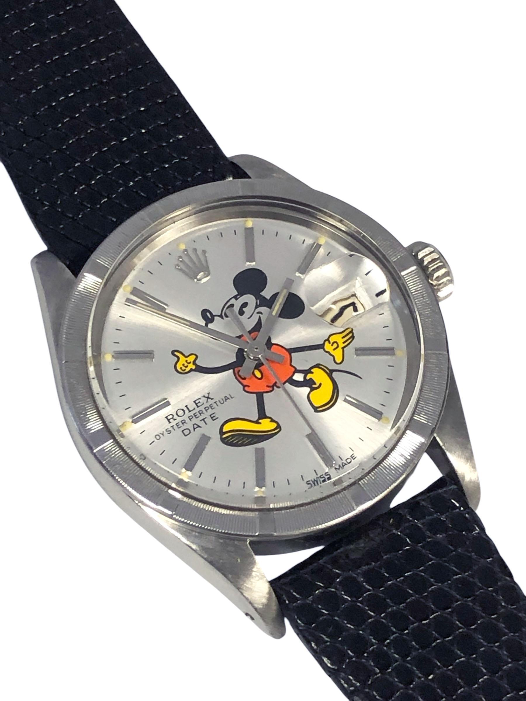 Circa 1972 Rolex Wrist Watch, 34 M.M Stainless Steel 3 piece Oyster case with Engine turned bezel, Caliber 1570 Automatic, self winding movement, Silver satin dial with raised stick markers,sweep seconds hand and a custom printed Mickey Mouse,