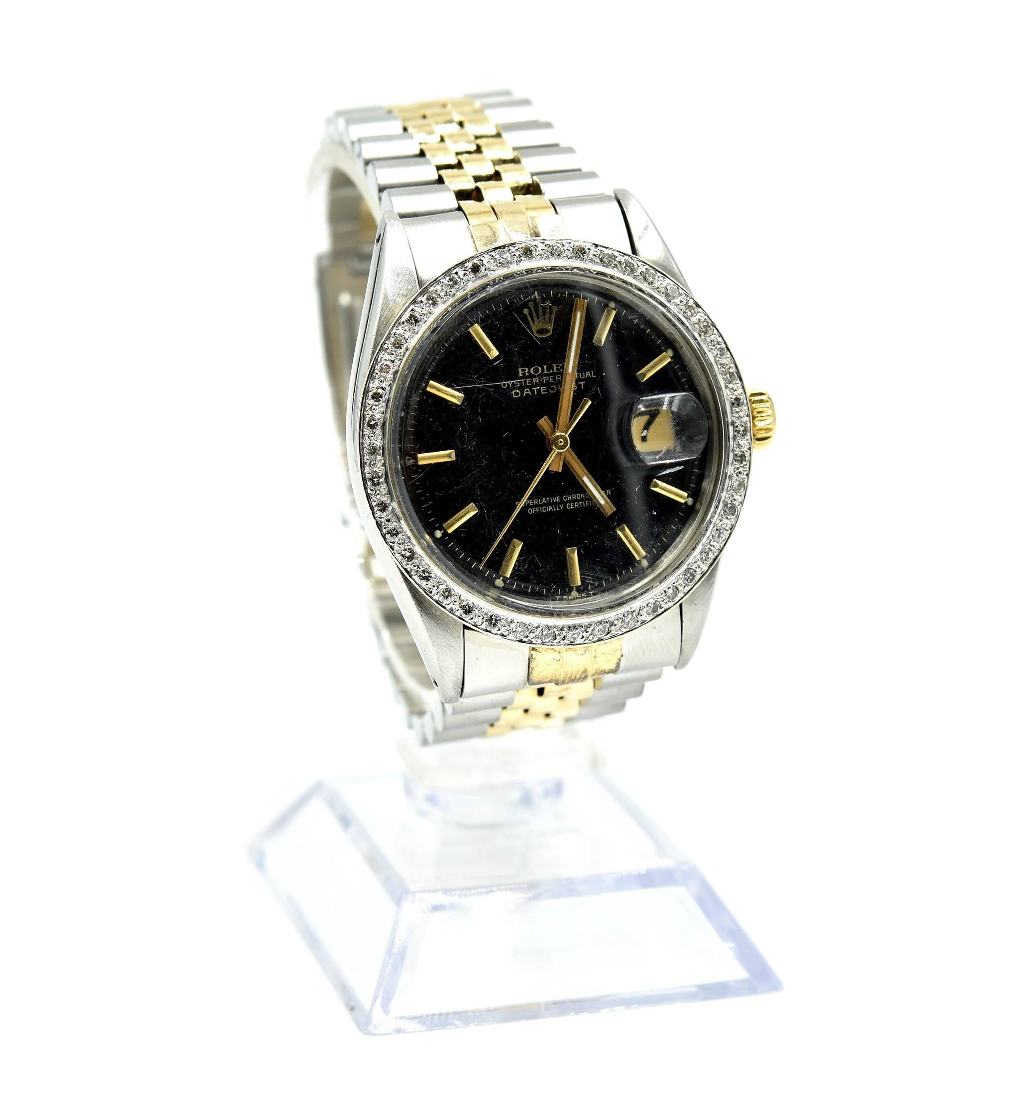 Movement: automatic
Function: hours, minutes, seconds, date
Case: round 36mm stainless steel case with custom diamond bezel, plastic crystal, 18k yellow gold screw-down crown, waterproof to 100 meters
Band: custom stainless steel and 18k yellow gold