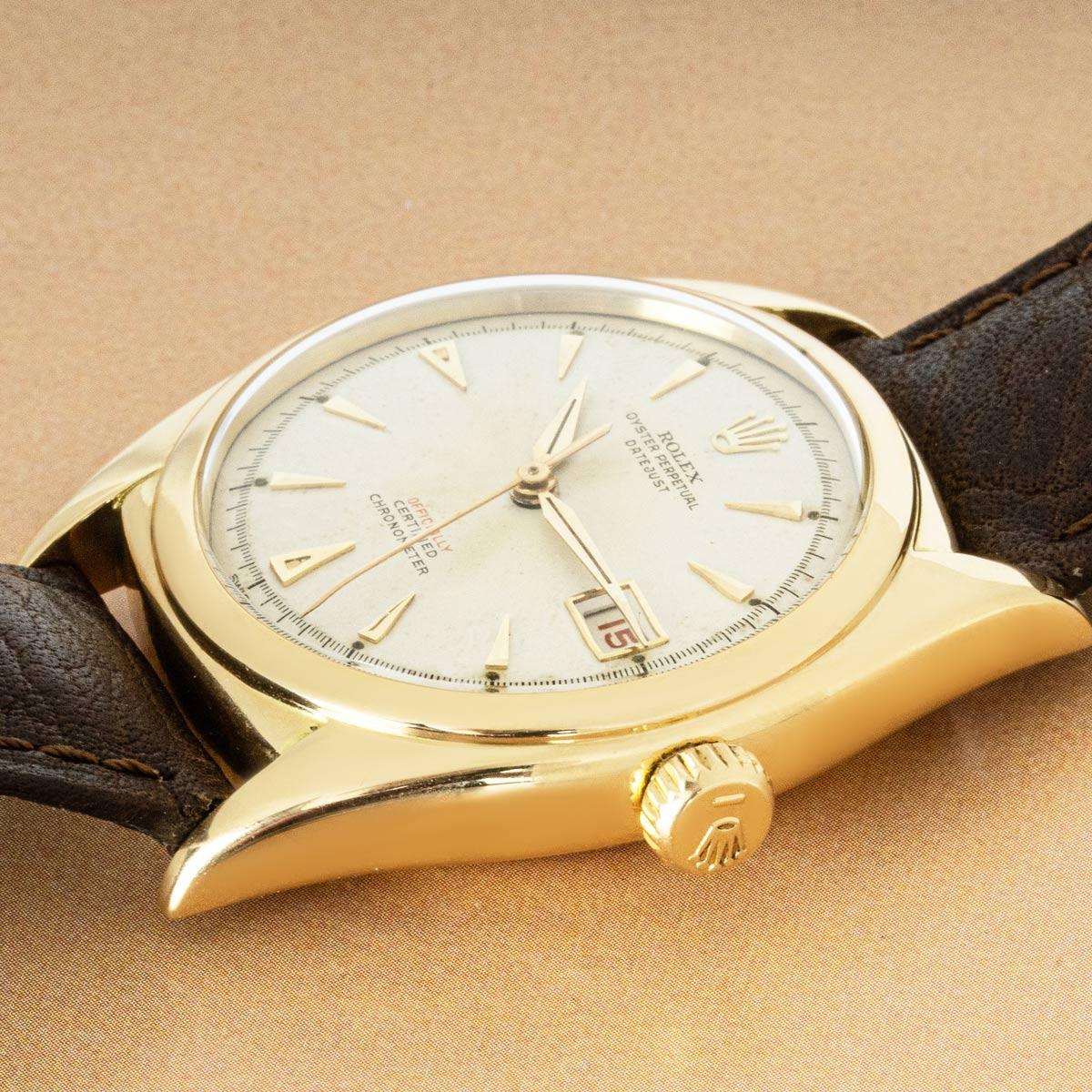 A rare 36mm vintage Datejust in yellow gold. Featuring a silver dial with the date display at 3 o'clock in red. Also features a smooth yellow gold bezel which is quite hard to come by. Fitted with plastic glass and a self-winding automatic movement,