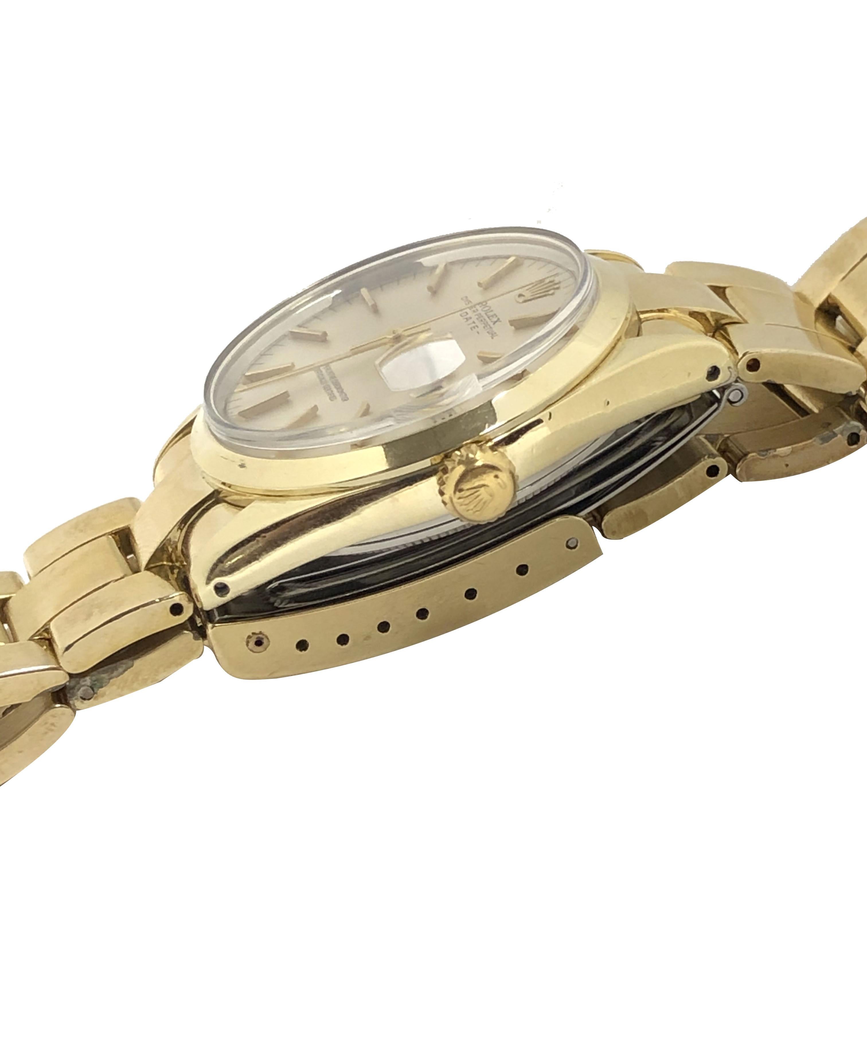Circa 1972 Rolex Reference 1550 Date Wrist Watch, 34 M.M. 2 piece Gold Shell Oyster case with Steel back, Caliber 1570 Automatic Self Winding movement Near mint Silver Satin Dial with raised Gold Markers, sweep seconds hand and a Calendar window at