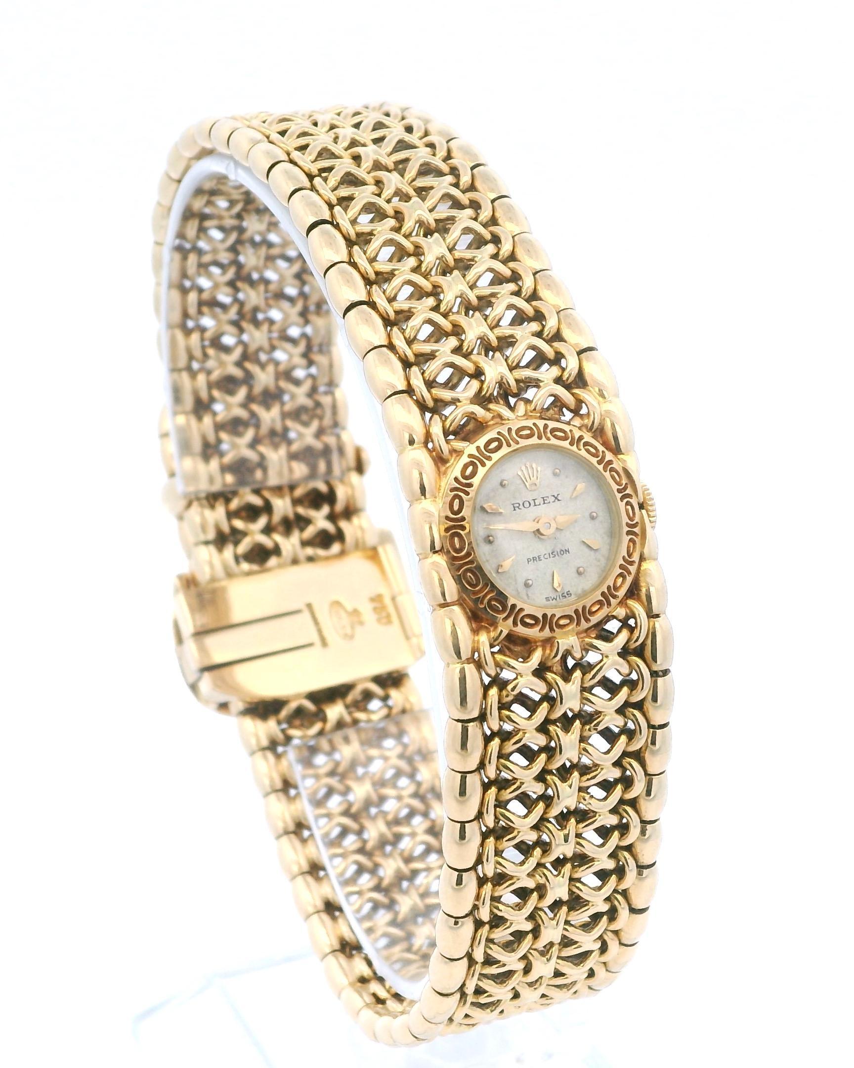A luxurious Rolex watch, crafted in 18k Yellow Gold, featuring an intricate mesh bracelet design and a refined dial.

Total weight: 73.08g