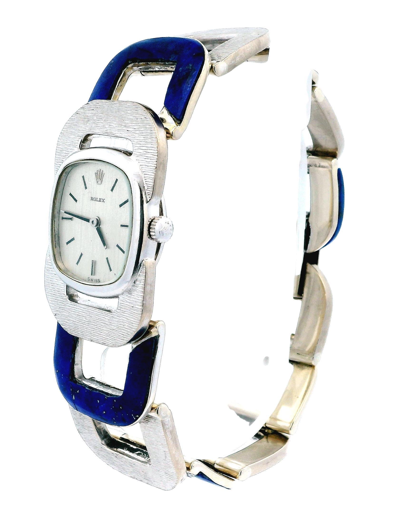 Rolex Cushion Watch is a statement of elegance.

This luxurious timepiece features a cushion-shaped case crafted from 18k gold, exuding sophistication.

The manual movement ensures precision, while the silver dial with stick indexes offers a classic