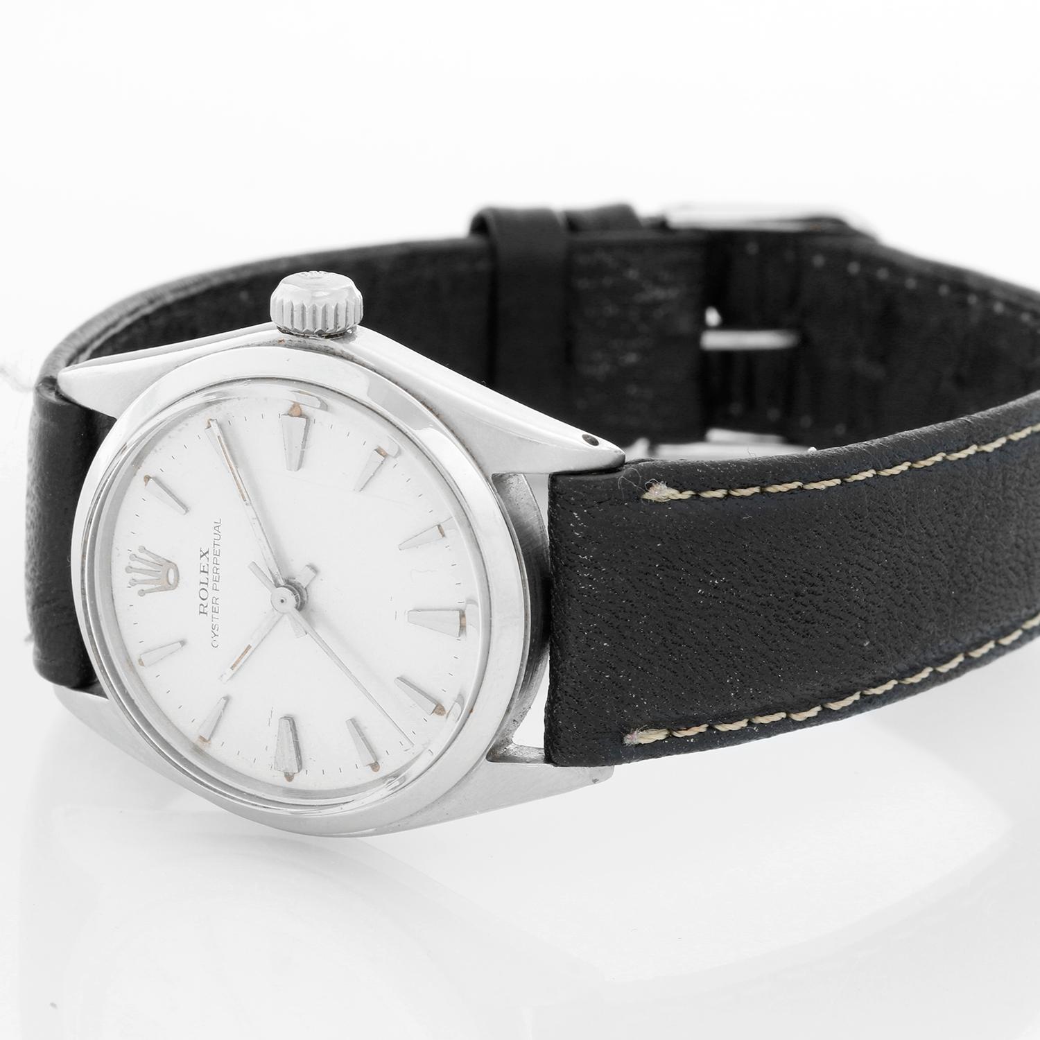 Rolex Vintage Oyster Perpetual Stainless Steel Midsize Watch 6548 - Automatic winding; acrylic crystal. Stainless steel with smooth bezel (31mm diameter). Silver dial with gold markers. Black alligator strap with buckle. Pre-owned with custom box.