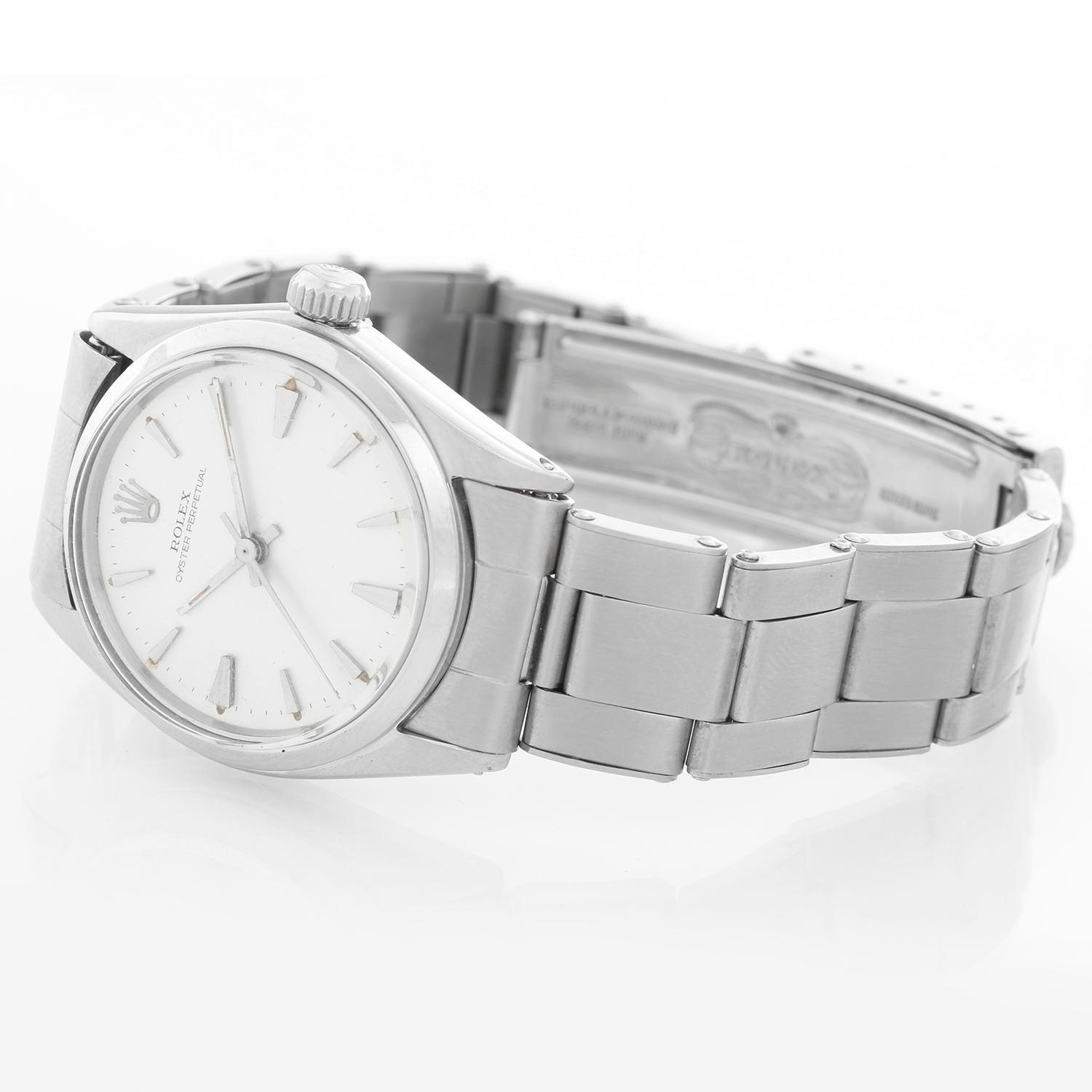 Rolex Vintage Oyster Perpetual Stainless Steel Midsize Watch 6548 - Automatic winding; acrylic crystal. Stainless steel with smooth bezel (31mm diameter). Silver dial with gold markers. Stainless Steel Rolex oyster bracelet. Pre-owned with custom