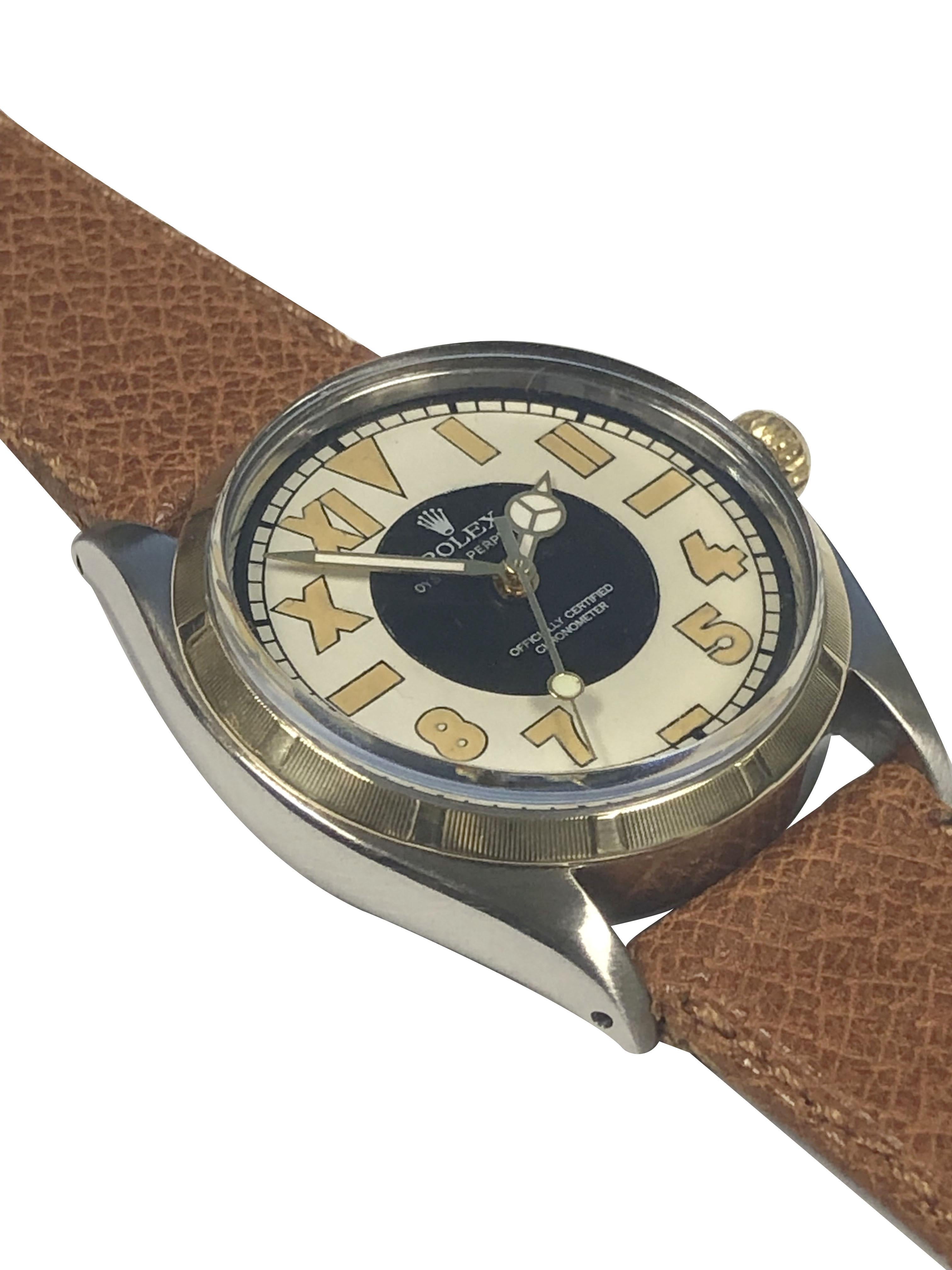 Circa 1950 Rolex Oyster Perpetual Reference 6565 Wrist Watch, 34 M.M. Stainless Steel 3 piece Oyster case with an Engine turned 14k Yellow Gold Bezel. Caliber 1560 Automatic, self winding Nickle Lever movement, Gold Rolex Logo Crown. New Custom