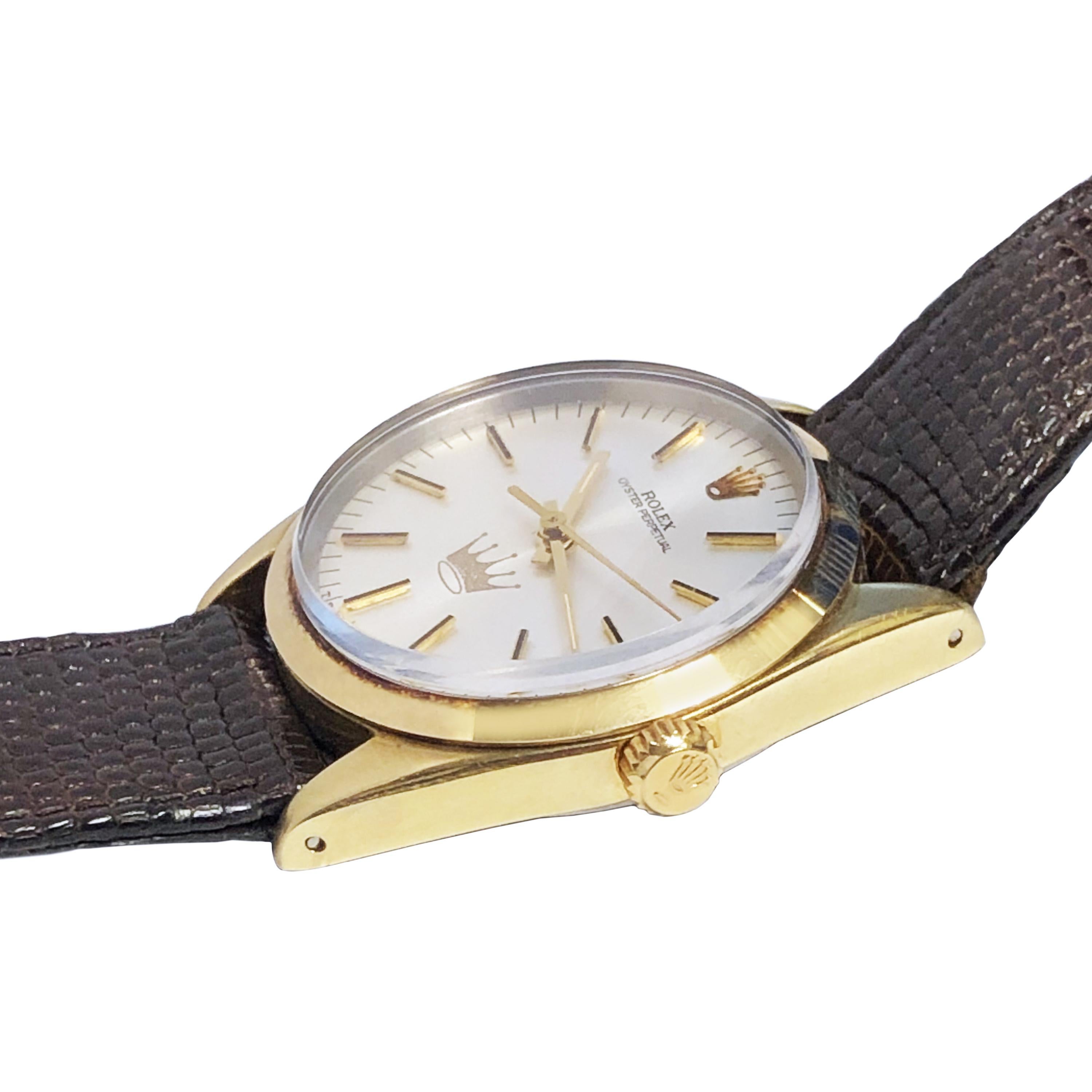 Circa 1984 Rolex Reference 1024 Wrist watch, 34 m.m. Gold Shell with Steel back Oyster case. Caliber 1570 automatic, self winding movement. Silver Satin dial with raised markers, sweep seconds hand and a company Crown form logo of the Hallmark