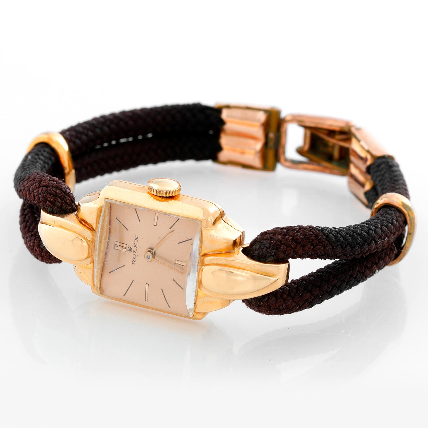 Rolex Vintage Rose Gold Ladies Dress Watch - Manual winding . Rose gold case ( 17 x 35 mm ) . Salmon colored dial with stick hour markers . Double rope strap; will fit up to a 6 inch wrist . Pre-owned with custom box. Circa 1940-'s-1950's .