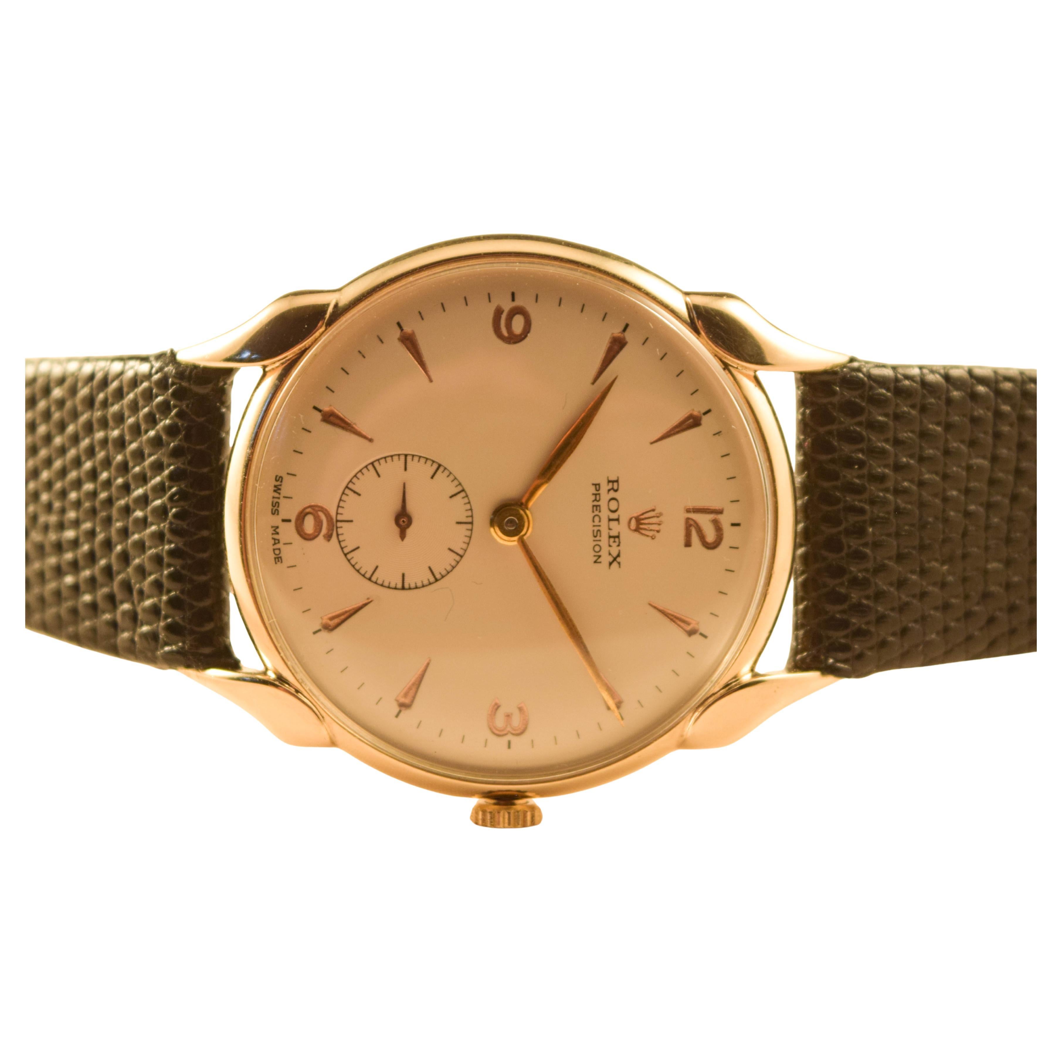 Rolex vintage  extremely rare watch with unusual scallop lugs.
solid gold case in wonderful condntion running well.
fully restored cleaned and serviced.
dial is signed rolex precision
gold markers and numbers.
gold hands 
sub seconds at 6.
swiss