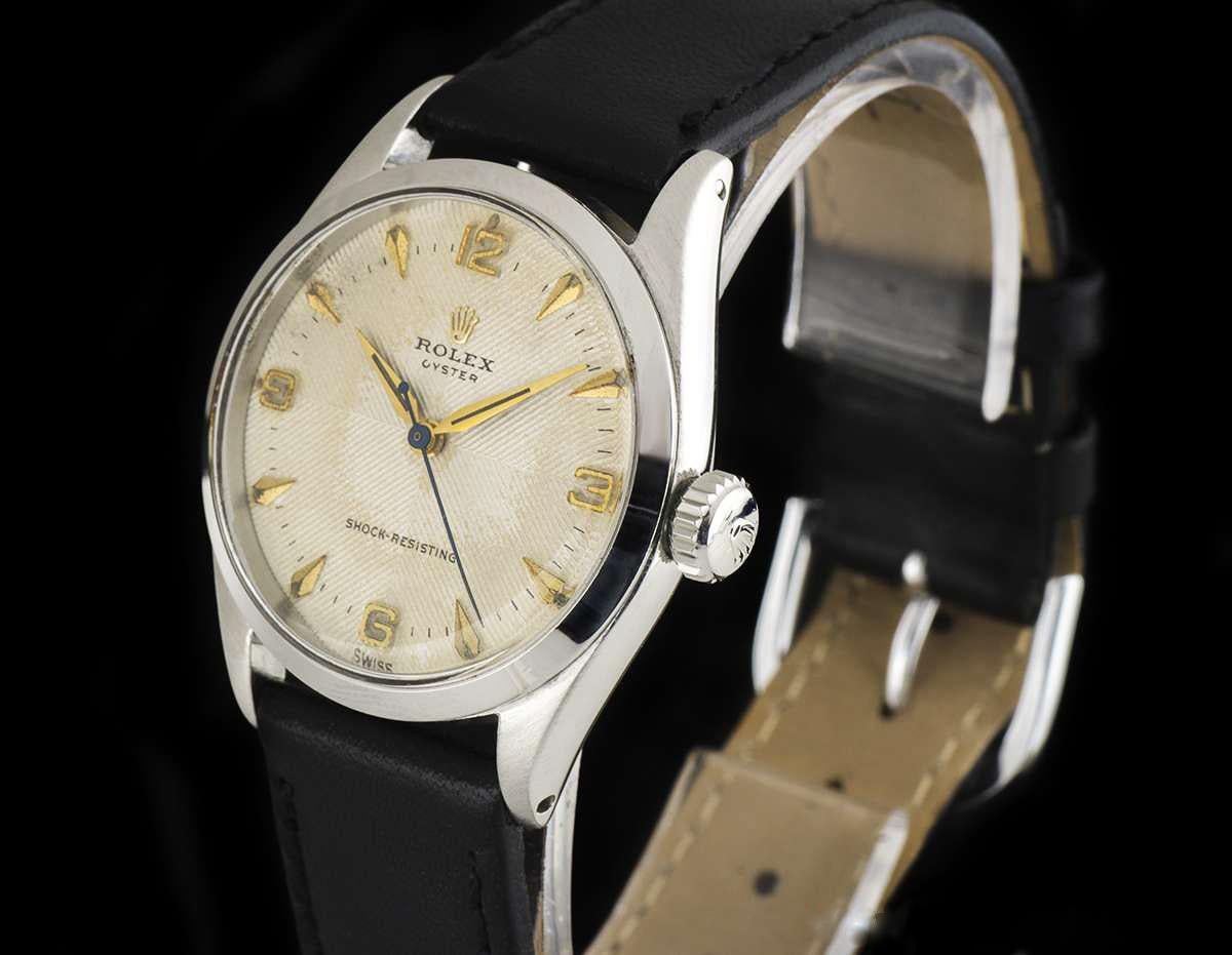 A Stainless Steel Oyster Shock Resisting Vintage Gents Wristwatch, rare cream quadrante dial with applied arrowhead hour markers and applied arabic numbers 3, 6, 9 and 12, a fixed stainless steel smooth bezel, a black leather strap (not by Rolex)
