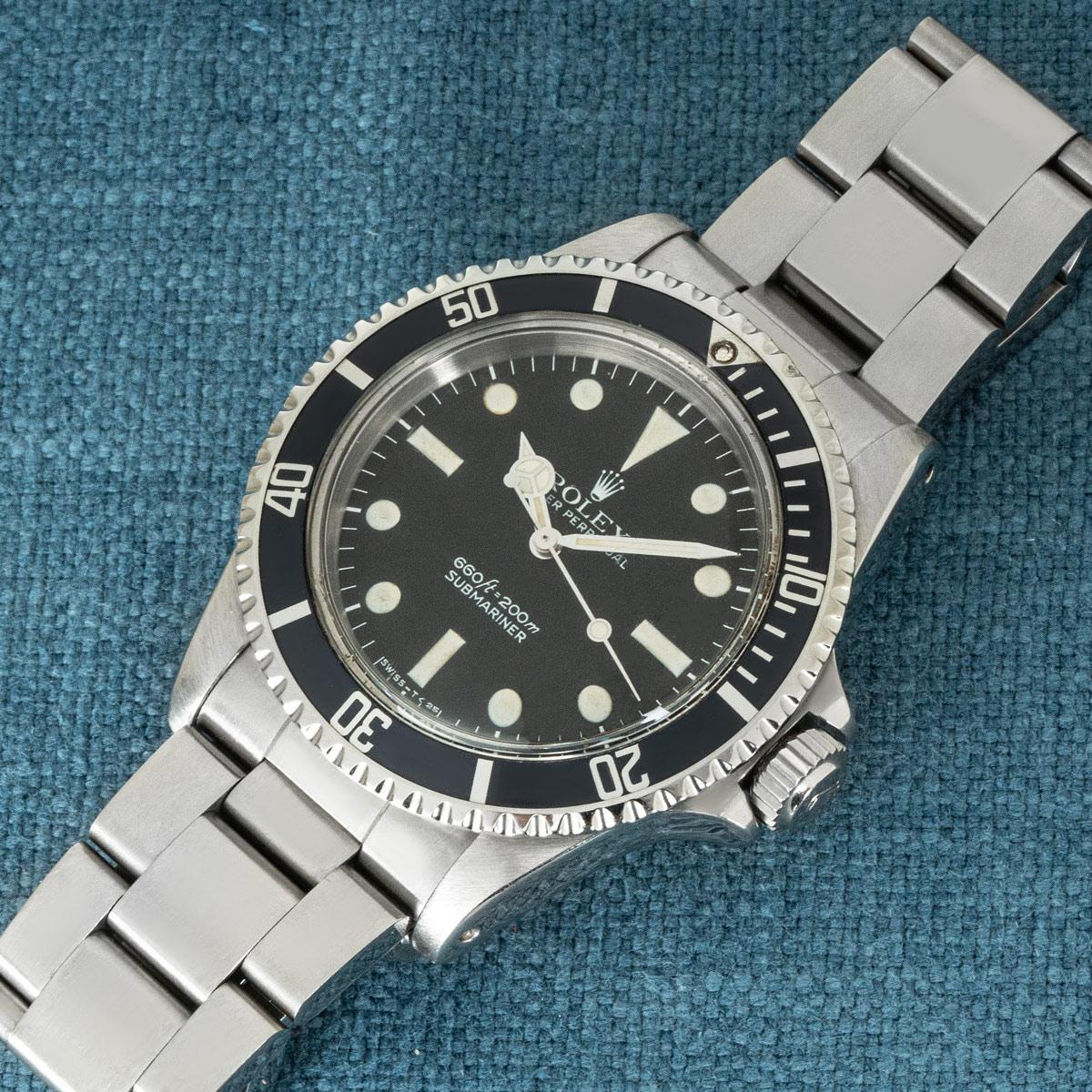 A stainless steel Non-Date vintage Submariner by Rolex. Features a matte black dial that is complemented by a bi-directional rotatable black bezel.

Fitted with a plastic glass and self-winding automatic movement, this timepiece comes on an Oyster