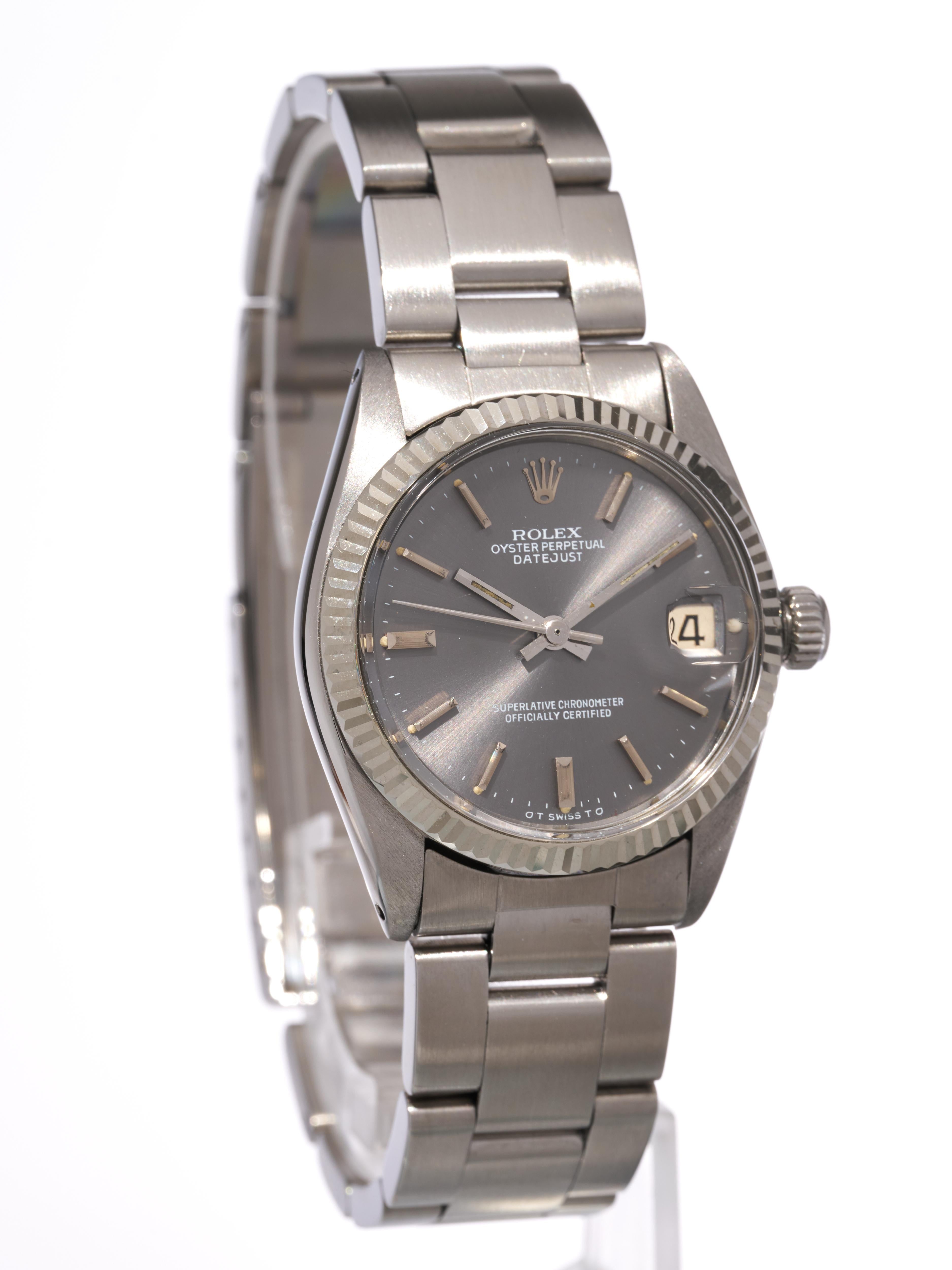 Rolex 
Datejust 

Montre de taille moyenne

31mm 

Cadran Sigma gris Rhodium Sunburst 
Lunette cannelée en or blanc 18K 

Boîtier et bracelet Oyster en acier inoxydable

Mouvement automatique 2030

Montre Référence 6827
Son numéro de série [406xxxx]