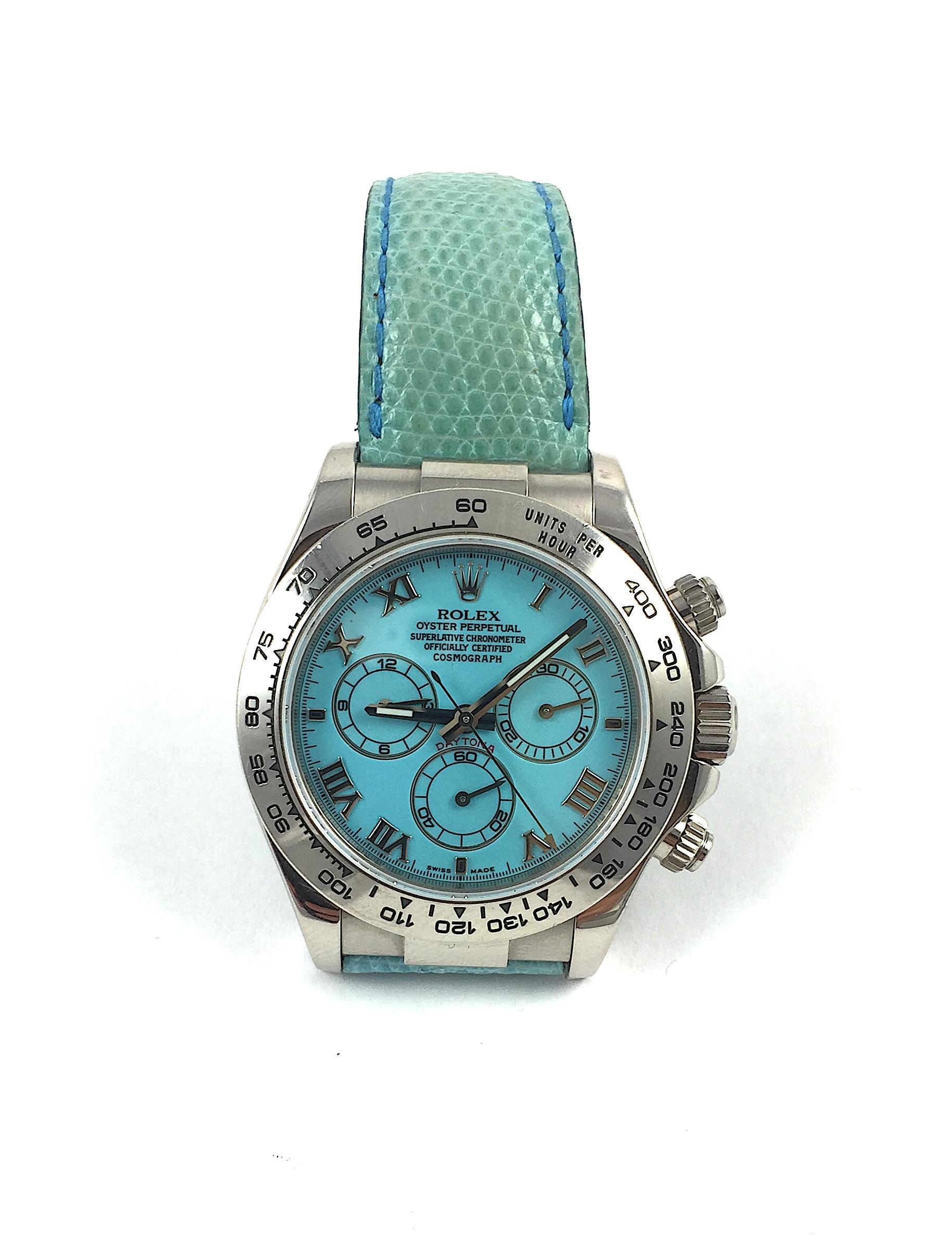 Rolex 18K White Gold Oyster Perpetual Cosmograph Daytona Wristwatch
Rare Factory Blue Turquoise Dial with Three Sub-Dials
18K White Gold Bezel Which Shows Wear and Some Use
40mm in size 
Rolex Calibre 4130 Automatic Chronograph Movement
Sapphire