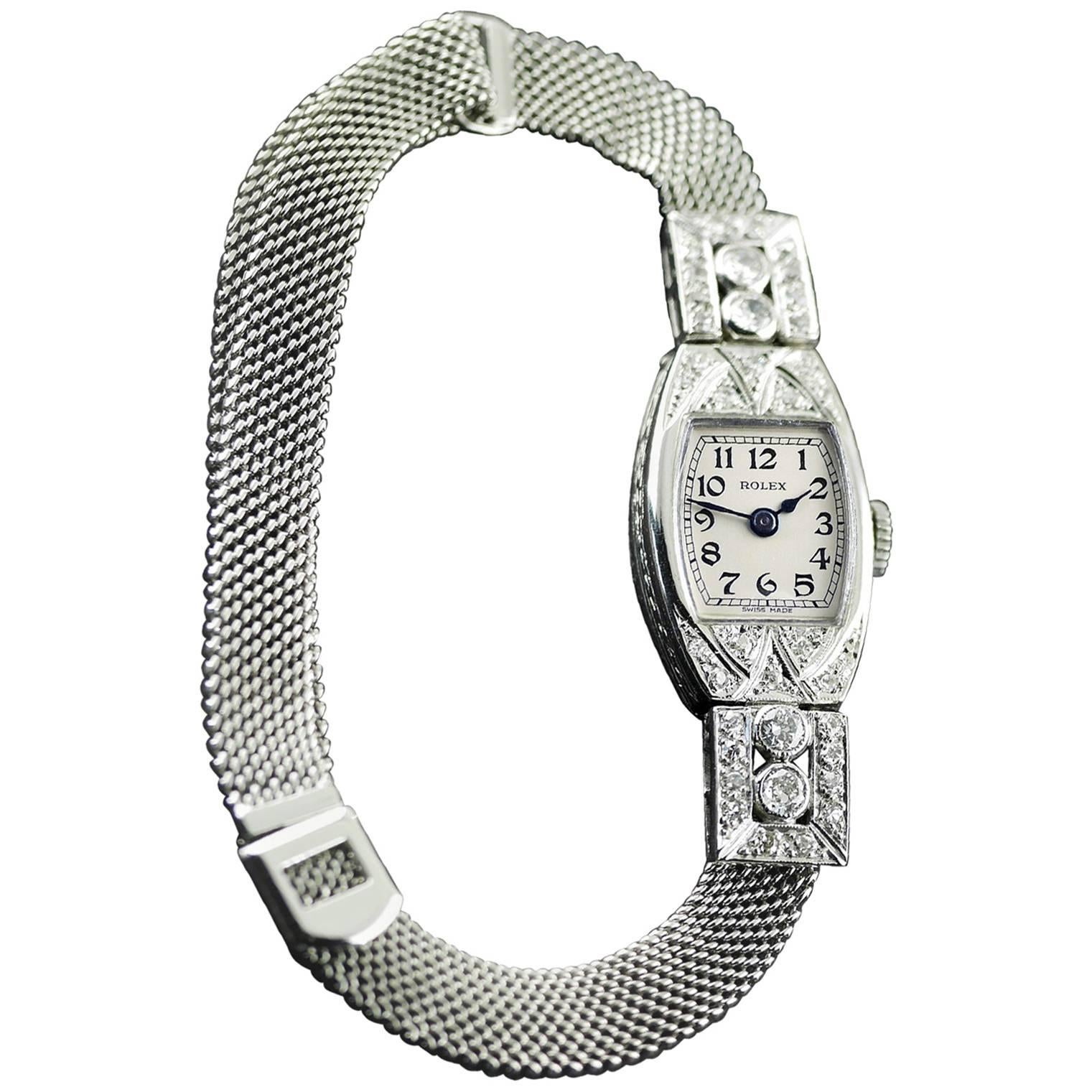 An Art Deco vintage wristwatch by Rolex made in 1926.

18 carat white gold case, set with diamonds with engraved 