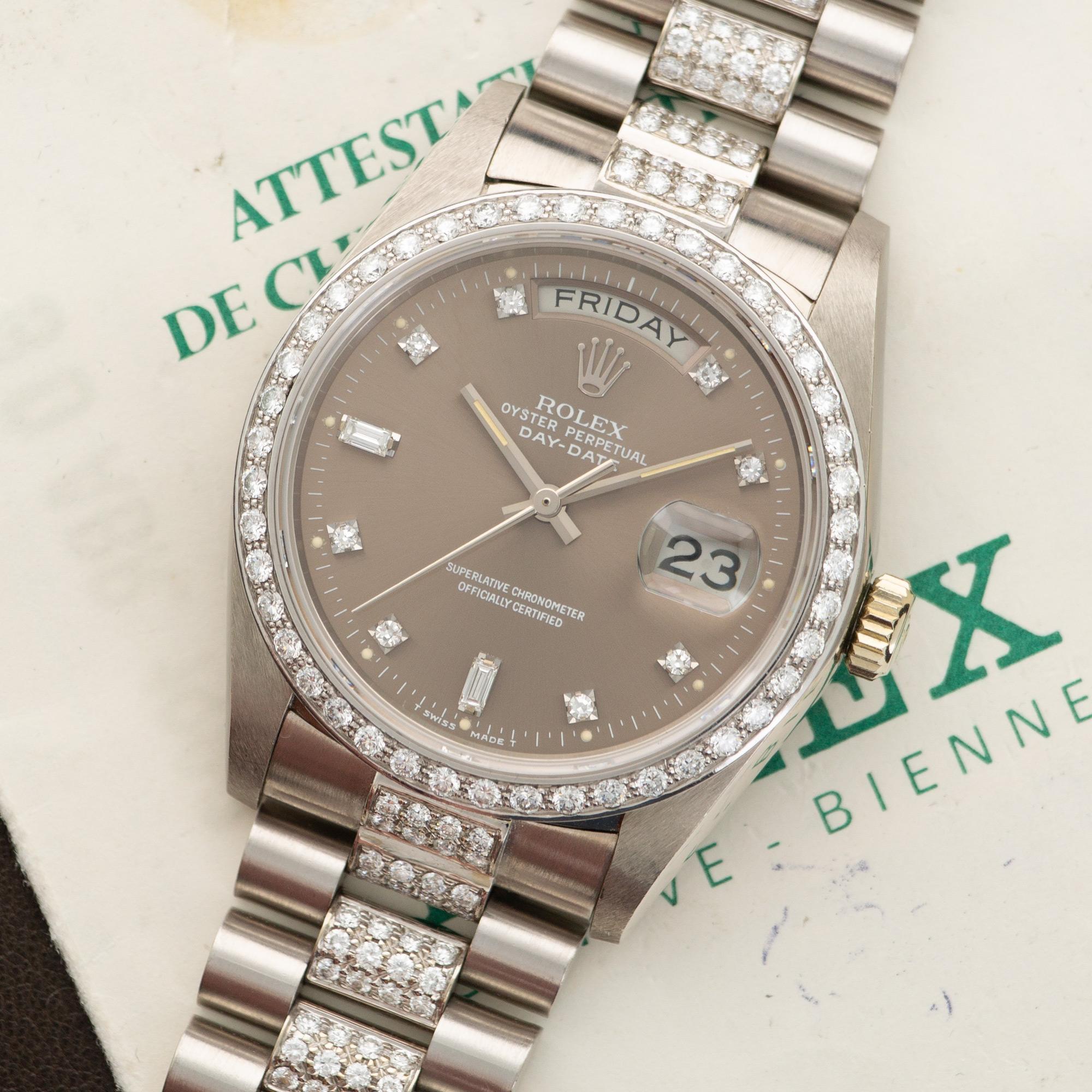 An 18k White Gold Day-Date Wristwatch with Original Diamonds by Rolex. Model # 18049A. 36mm Diameter. Accompanied by its Original Rolex Warranty Paper.