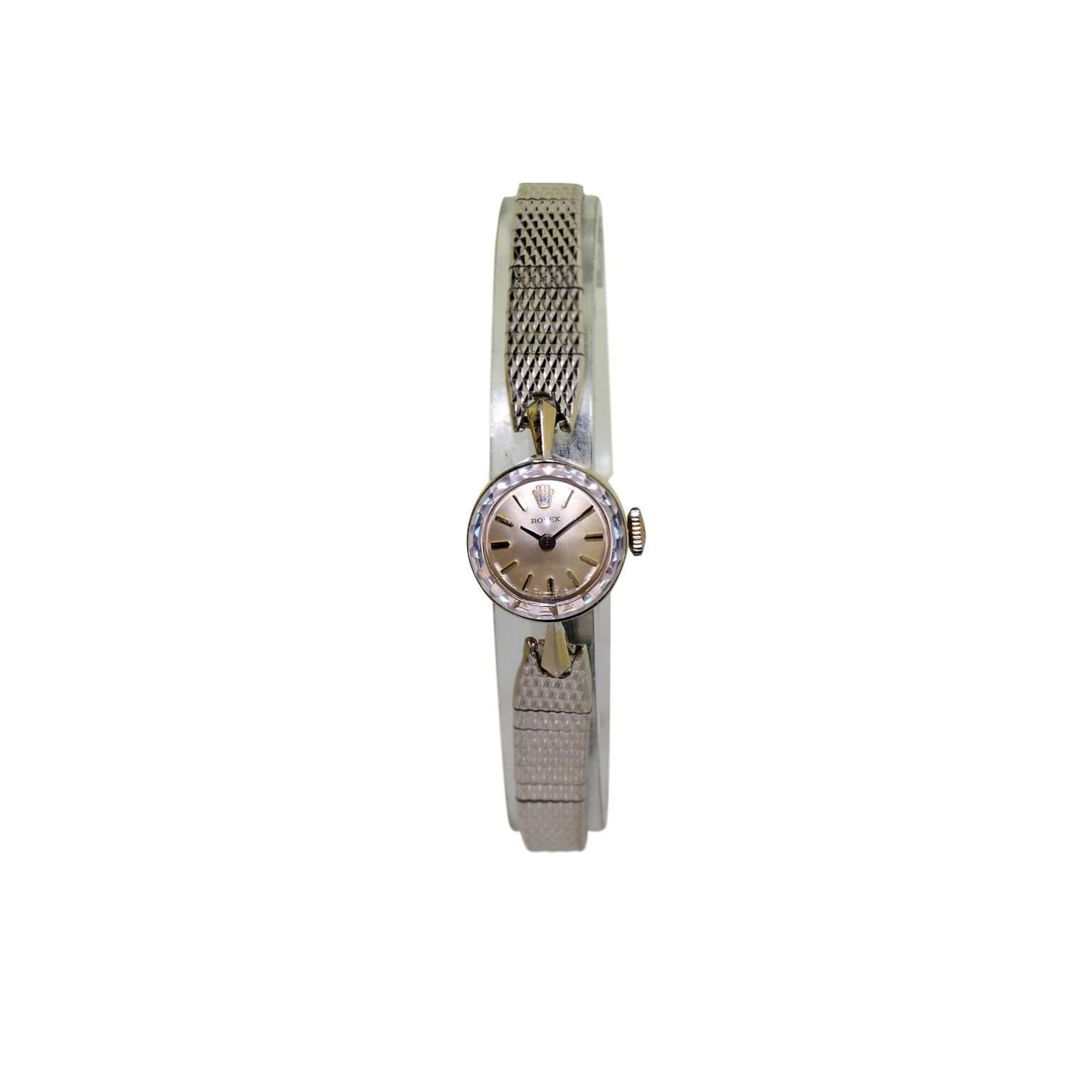 FACTORY / HOUSE: Rolex Watch Company
STYLE / REFERENCE: Ladies Evening Watch
METAL / MATERIAL: 14Kt. Solid White Gold / White Gold Filled Period Bracelet
CIRCA: 1960's
DIMENSIONS: 26mm X 14mm
MOVEMENT / CALIBER: Manual Winding / 17 Jewels / Cal.