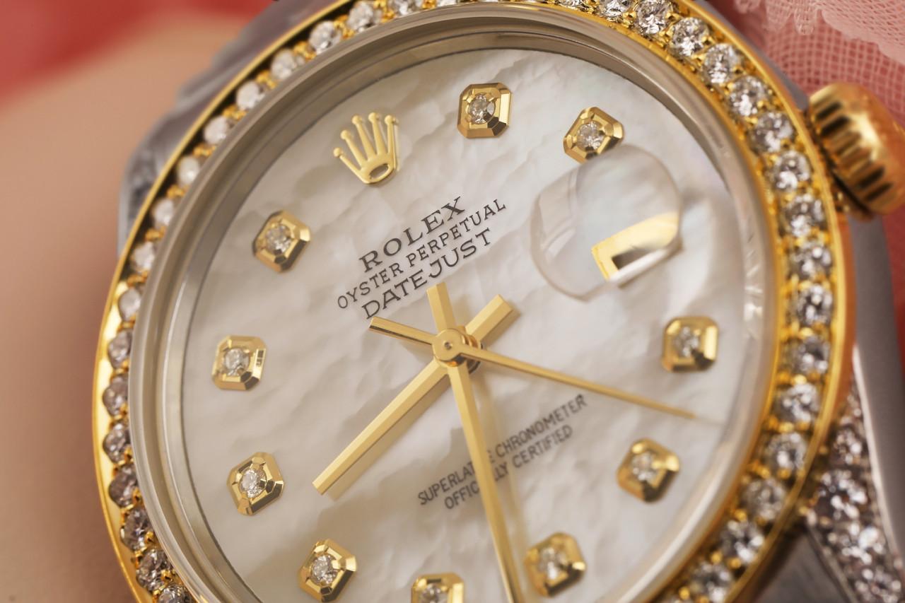 Rolex White Mother Of Pearl Dial with Round Diamonds Datejust 36mm Two Tone Watch 16013
This watch is in like new condition. It has been polished, serviced and has no visible scratches or blemishes. All our watches come with a standard 1 year